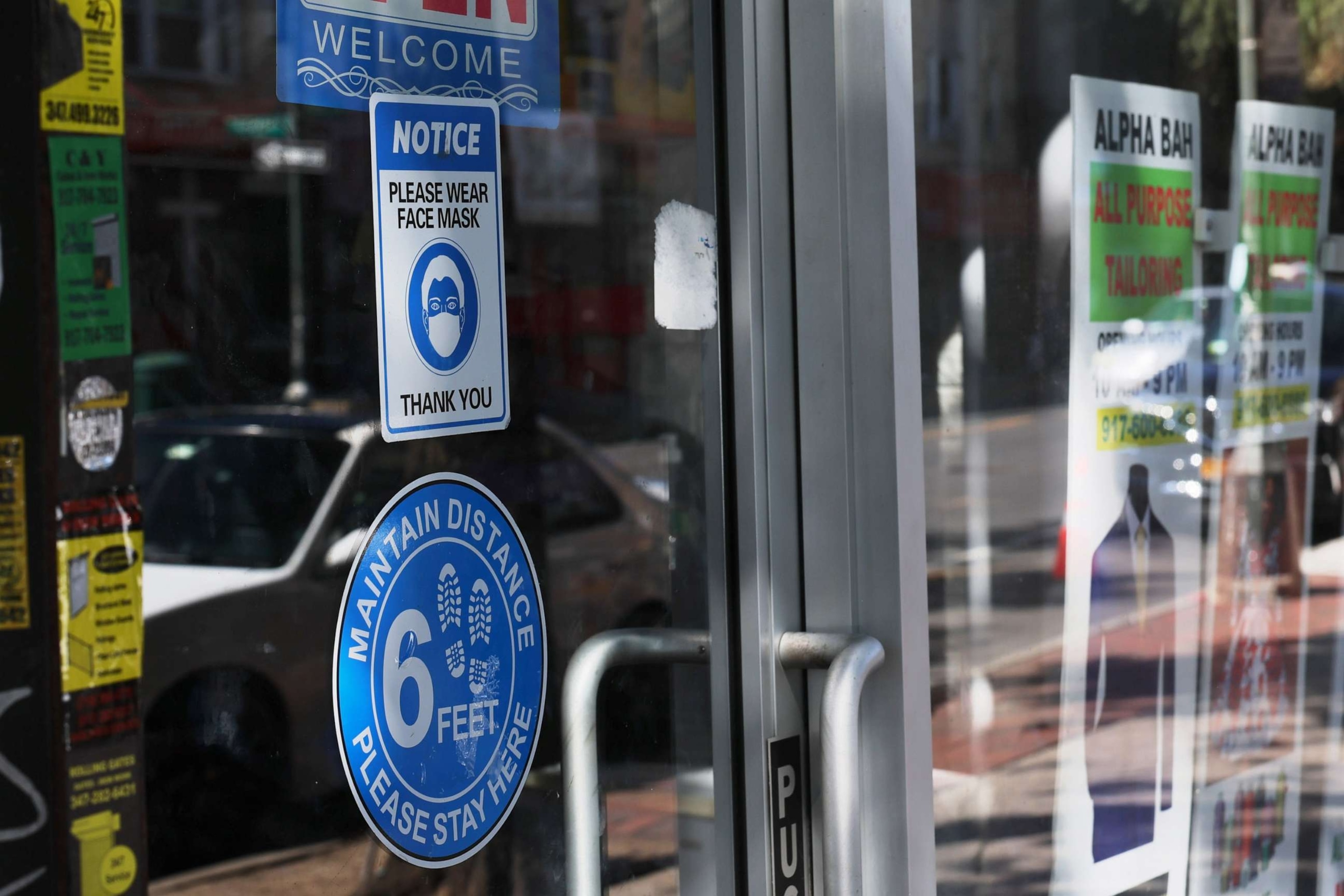 PHOTO: A mask-required sign is seen on a door of a store on Sept. 1, 2023 in the Brooklyn borough in New York City