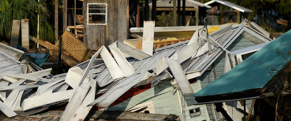 FILE - An unstilted home which came off its blocks sits partially submerged in a canal, in Horseshoe Beach, Fla., Friday, Sept. 1, 2023, two days after the passage of Hurricane Idalia. (AP Photo/Rebecca Blackwell, File)