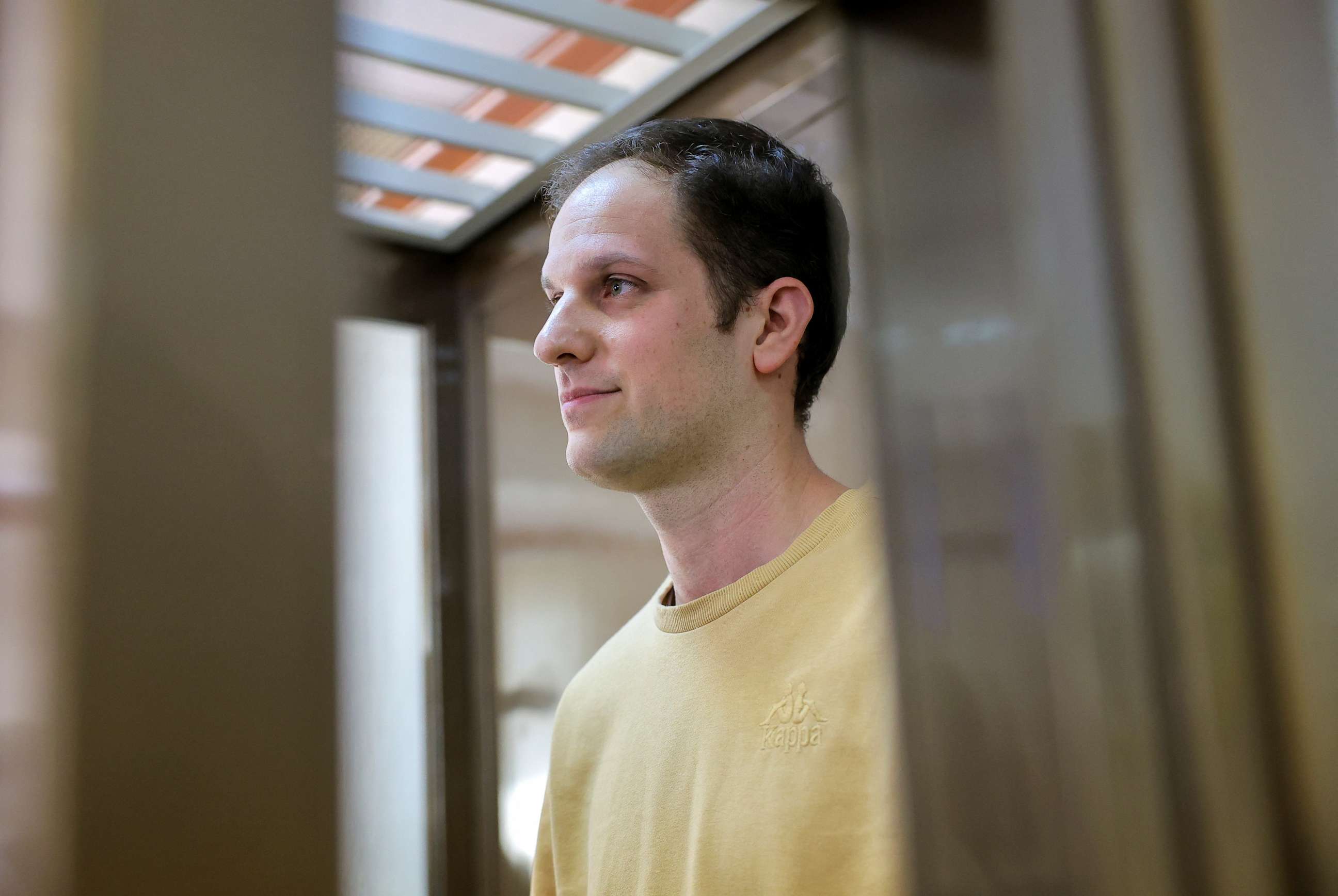 PHOTO: Wall Street Journal reporter Evan Gershkovich stands inside an enclosure for defendants before a court hearing to consider an appeal against his pre-trial detention on espionage charges in Moscow, Russia, Sept. 19, 2023.