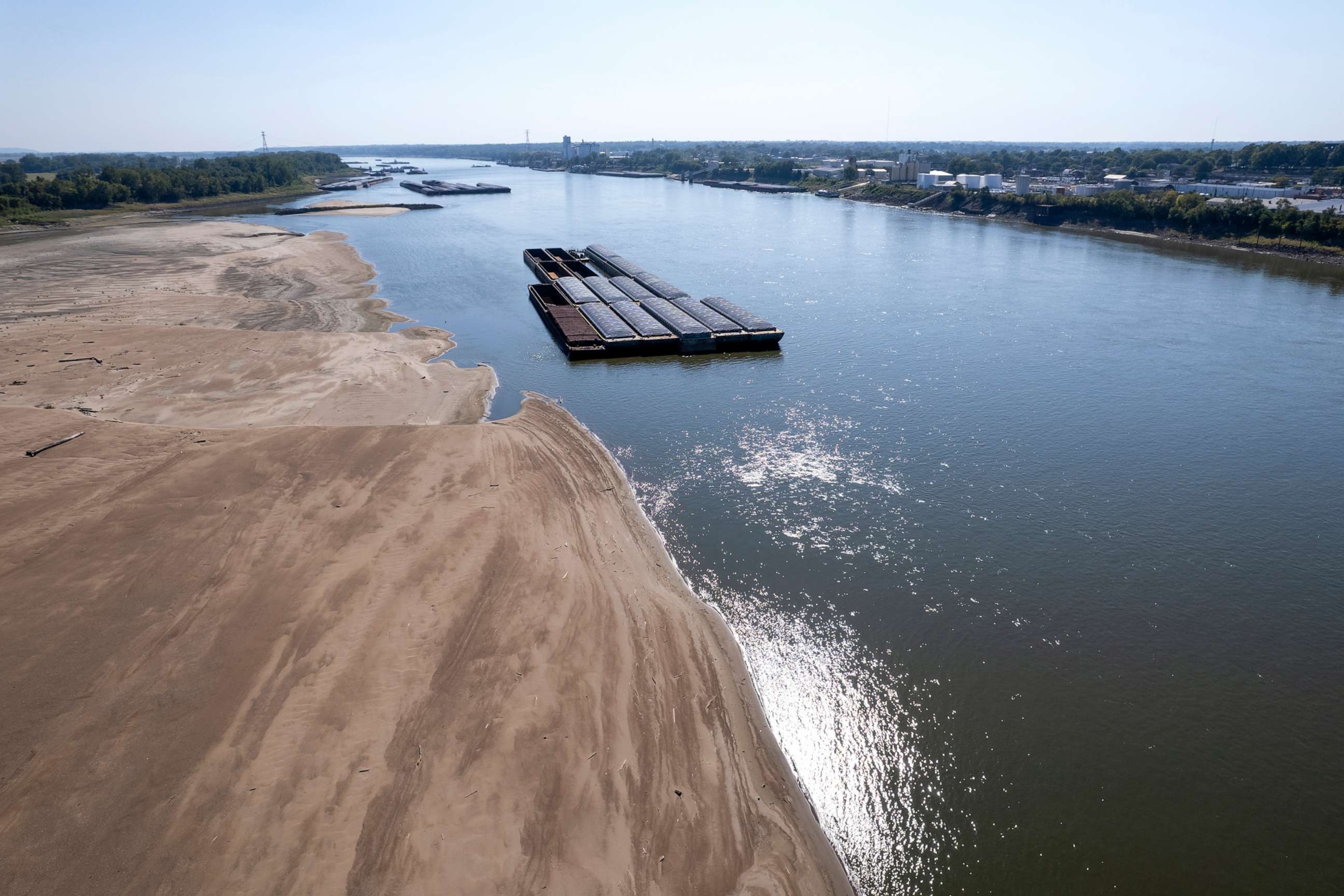 PHOTO: Barges float in the Mississippi River as a portion of the riverbed is exposed, on Sept. 15, 2023, in St. Louis.