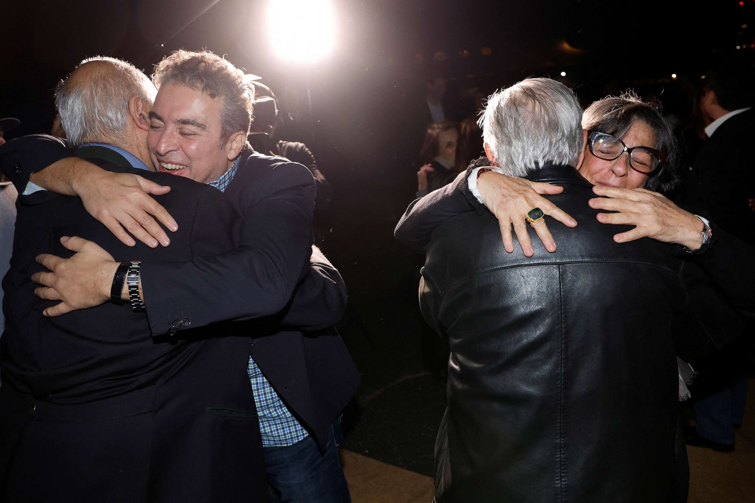 PHOTO: Family members embrace freed Americans Siamak Namazi, Morad Tahbaz and Emad Shargi as well as two returnees whose names have not yet been released by the U.S. government at Davison Army Airfield at Fort Belvoir, Va., Sept. 19, 2023.