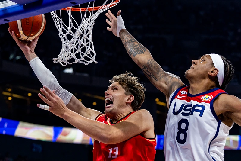 USA v Germany: Semi Final - FIBA Basketball World Cup
MANILA, PHILIPPINES - SEPTEMBER 08: Moritz Wagner #13 of Germany drives to the basket against Paolo Banchero #8 of the United States during the FIBA Basketball World Cup Semi Final game between USA and Germany at Mall of Asia Arena on September 08, 2023 in Manila, Philippines. (Photo by Ezra Acayan/Getty Images)