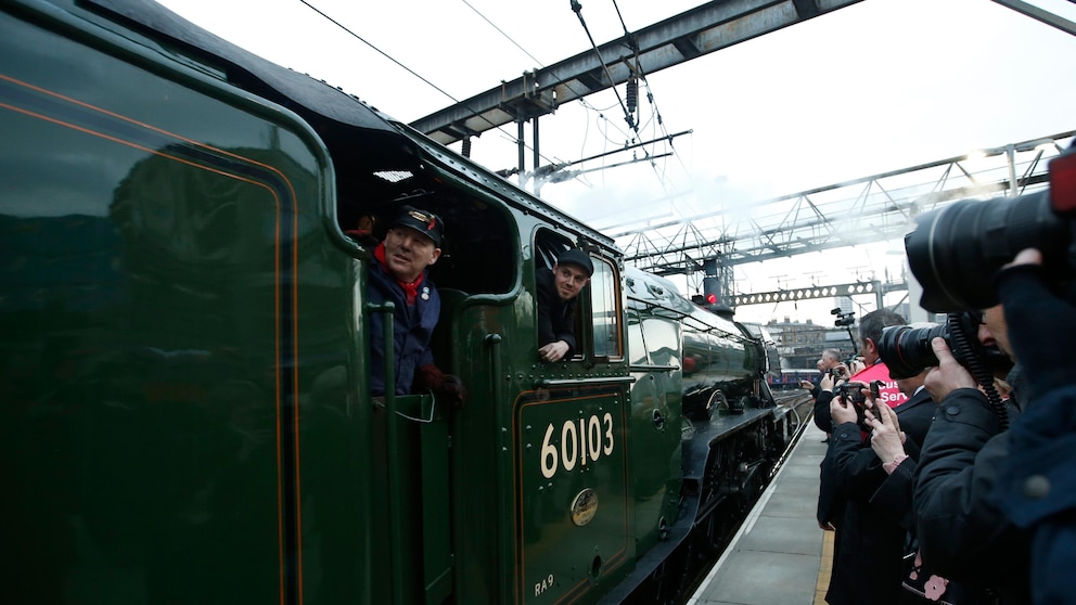 The Flying Scotsman, a historical locomotive, arrives at Kings Cross railway station in London to pick up passengers for its journey to York, Thursday, Feb. 25, 2016. Several people were injured after the Flying Scotsman, the historic steam locomotive, was involved in a “low speed” crash with another heritage train in the Scottish Highlands on Friday, Sept. 29, 2023. (AP Photo/Alastair Grant)