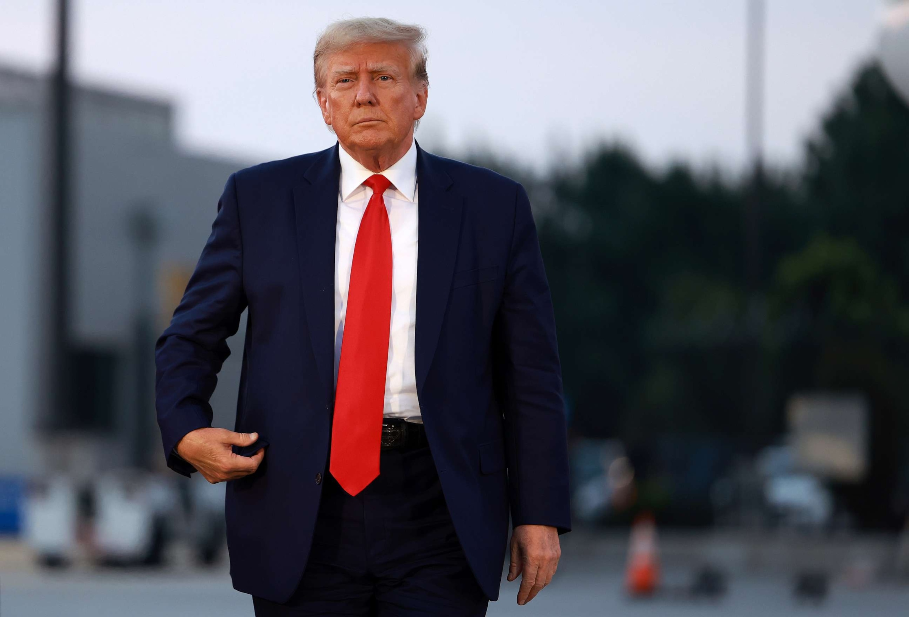 PHOTO: In this Aug. 24, 2023, file photo, former President Donald Trump arrives to depart at Atlanta Hartsfield-Jackson International Airport after being booked at the Fulton County jail in Atlanta.