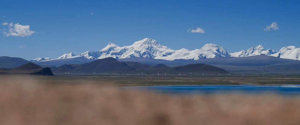 In this photo released by Xinhua News Agency, Mount Shishapangma is seen from Baiku Lake in Xigaze, southwest China's Tibet Autonomous Region on Sept. 2, 2023. American mountaineer Anna Gutu and a Nepalese guide Mingmar Sherpa were confirmed dead Sunday, Oct. 8, after avalanches struck the slopes of a Tibetan mountain, while two others remained missing, according to Chinese media reports. (Chen Zepeng/Xinhua via AP)