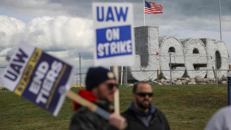 Auto workers escalate strike, walking out at largest Ford factory