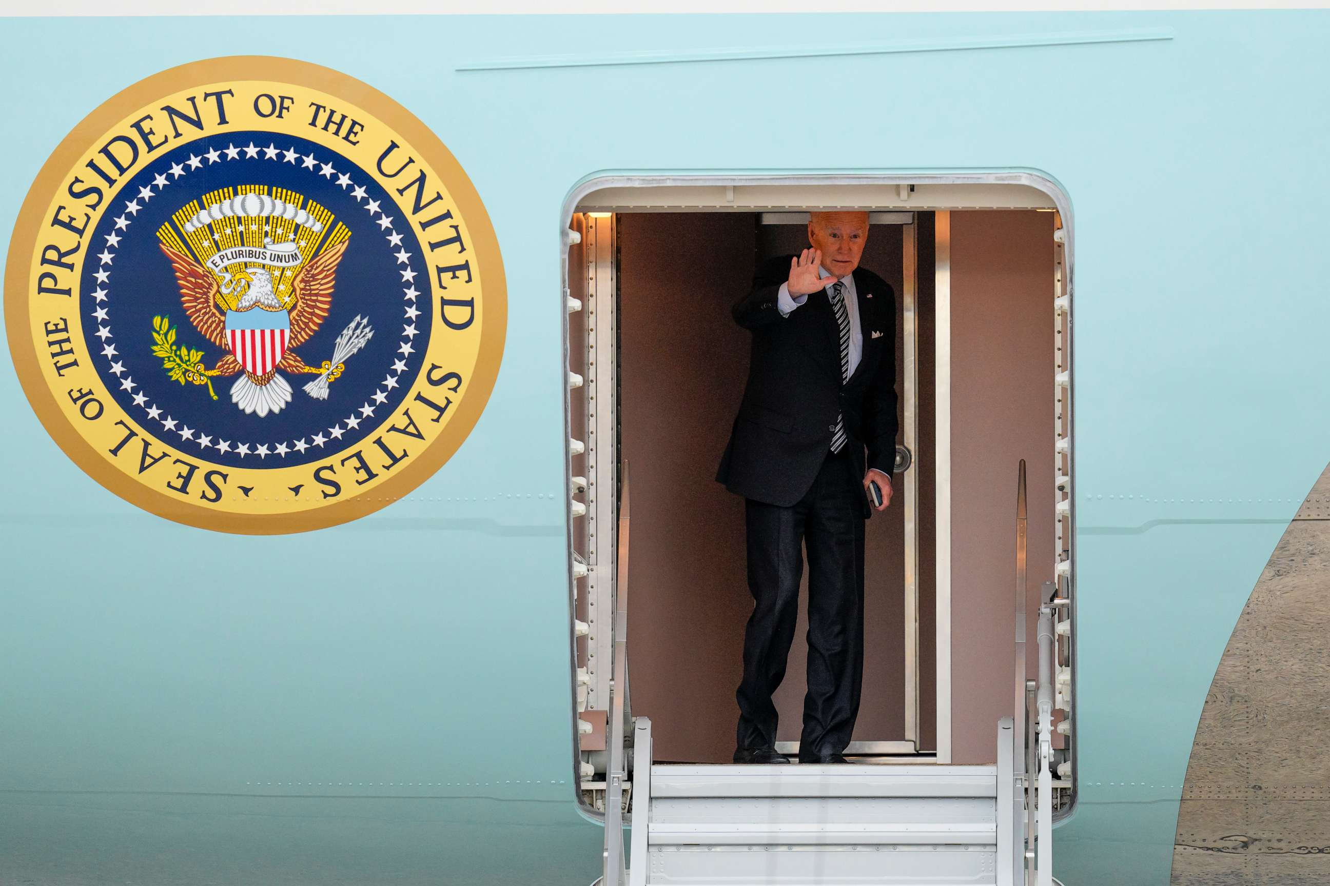 PHOTO: President Joe Biden waves as he boards Air Force One at Andrews Air Force Base, Md., Tuesday, Oct. 17, 2023, en route to Israel. (AP Photo/Jess Rapfogel)