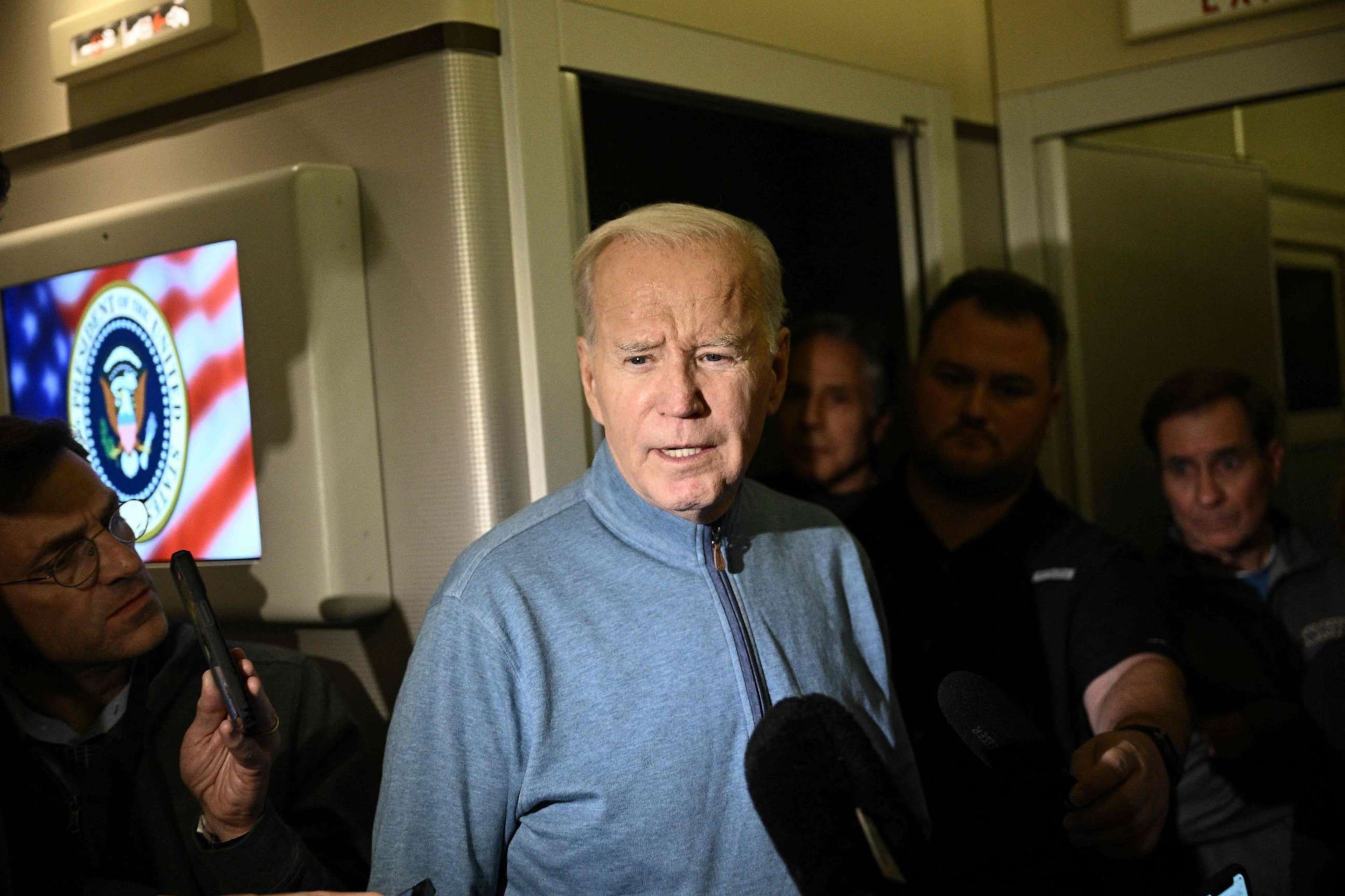 PHOTO: President Joe Biden speaks to members of the media during his flight returning from Israel aboard Air Force One, Oct. 18, 2023.