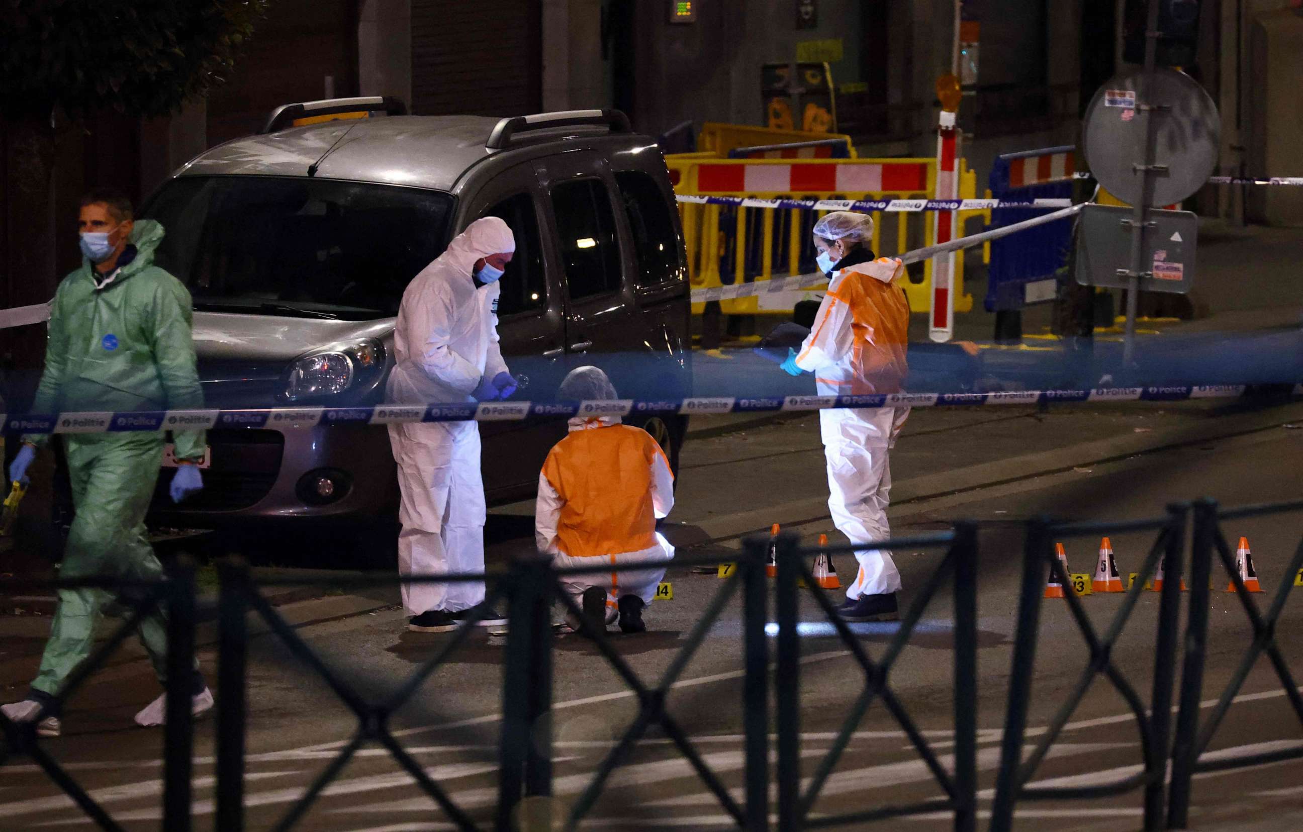 PHOTO: Belgian police officers from the forensic service search for evidence in a street after two people were killed during a shooting in Brussels on Oct. 16, 2023.