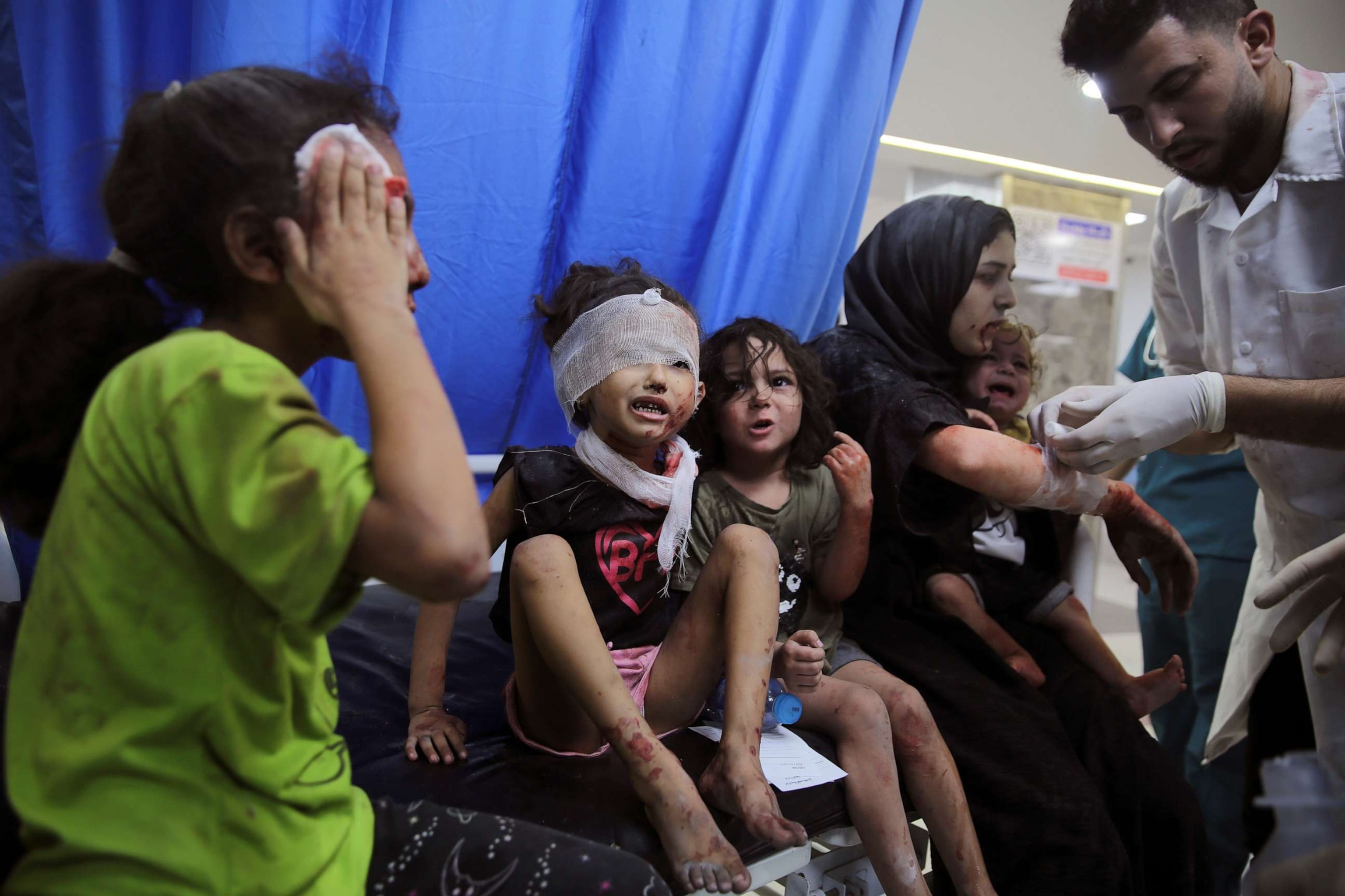 PHOTO: Palestinian children wounded in Israeli strikes are brought to Shifa Hospital in Gaza City on Wednesday, Oct. 11, 2023.