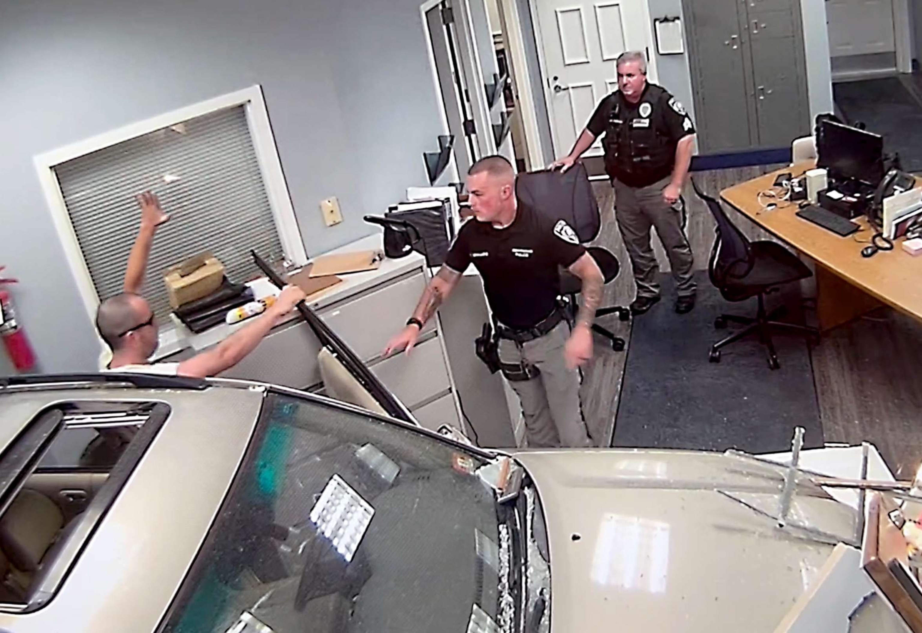 PHOTO: Surveillance image shows John Hargreaves being taken into custody after police said he deliberately drove his SUV into a home and the lobby of the Independence Township, New Jersey, Police Station on Sept. 20, 2023.