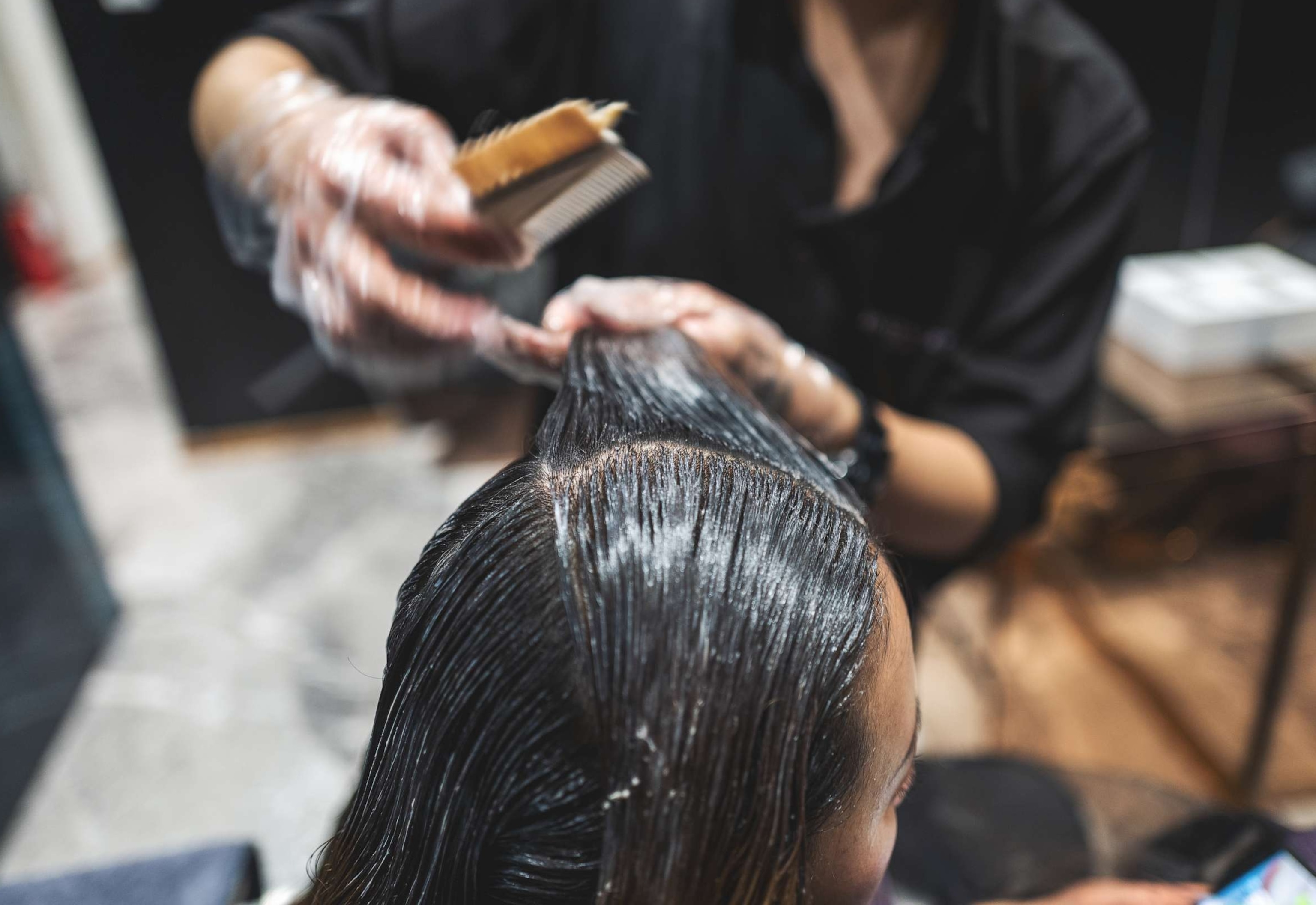 PHOTO: In an undated stock photo, a woman is seen getting her hair straightened in a salon.