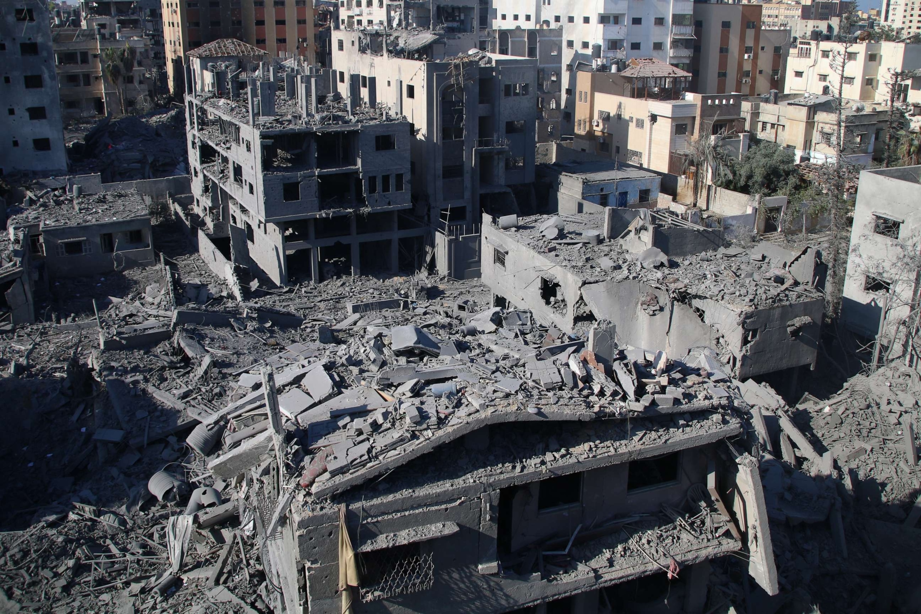 PHOTO: Citizens inspect damage to their homes caused by Israeli airstrikes, Oct. 13, 2023 in Gaza City, Gaza.