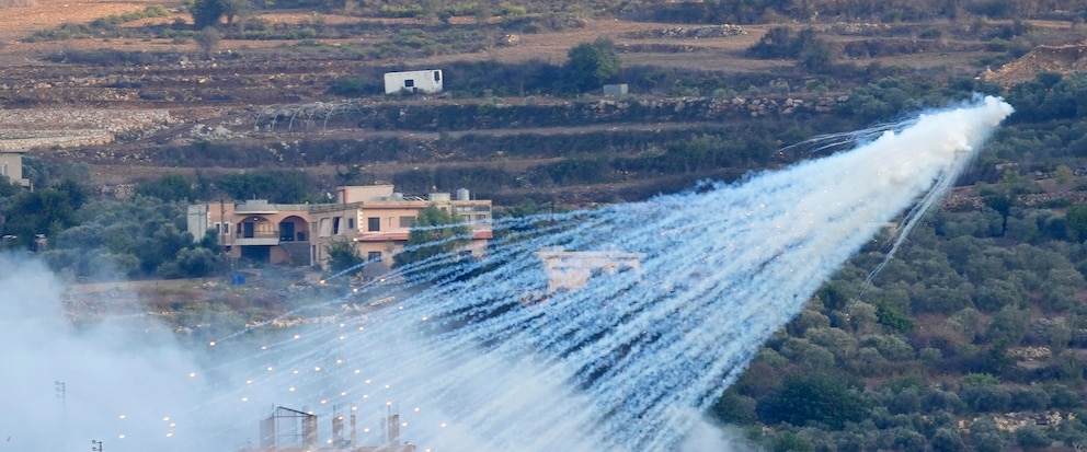 A shell from Israeli artillery explodes over a house in al-Bustan, a Lebanese border village with Israel, south Lebanon, Sunday, Oct. 15, 2023. Hamas Palestinian militants in southern Lebanon fired 20 rockets into the northern Israeli towns of Schlomi and Nahariyya, the group said in a statement. They said it was "in response to the (Israeli) occupation's crimes against our people in Gaza". (AP Photo/Hussein Malla)