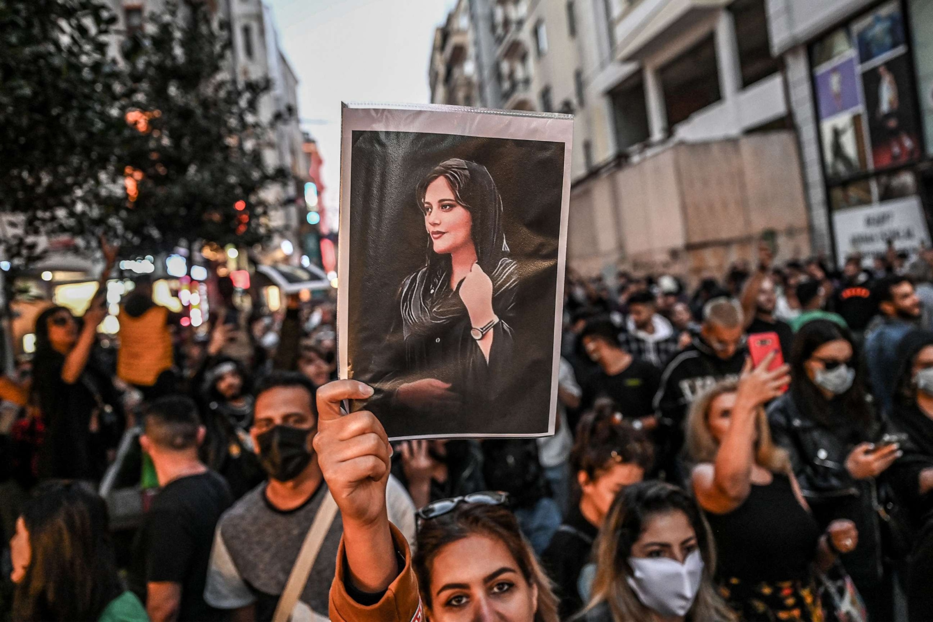 PHOTO: A protester holds a portrait of Mahsa Amini during a demonstration in support of Amini, a young Iranian woman who died after being arrested in Tehran by the Islamic Republic's morality police, Sept. 20, 2022, in Istanbul.