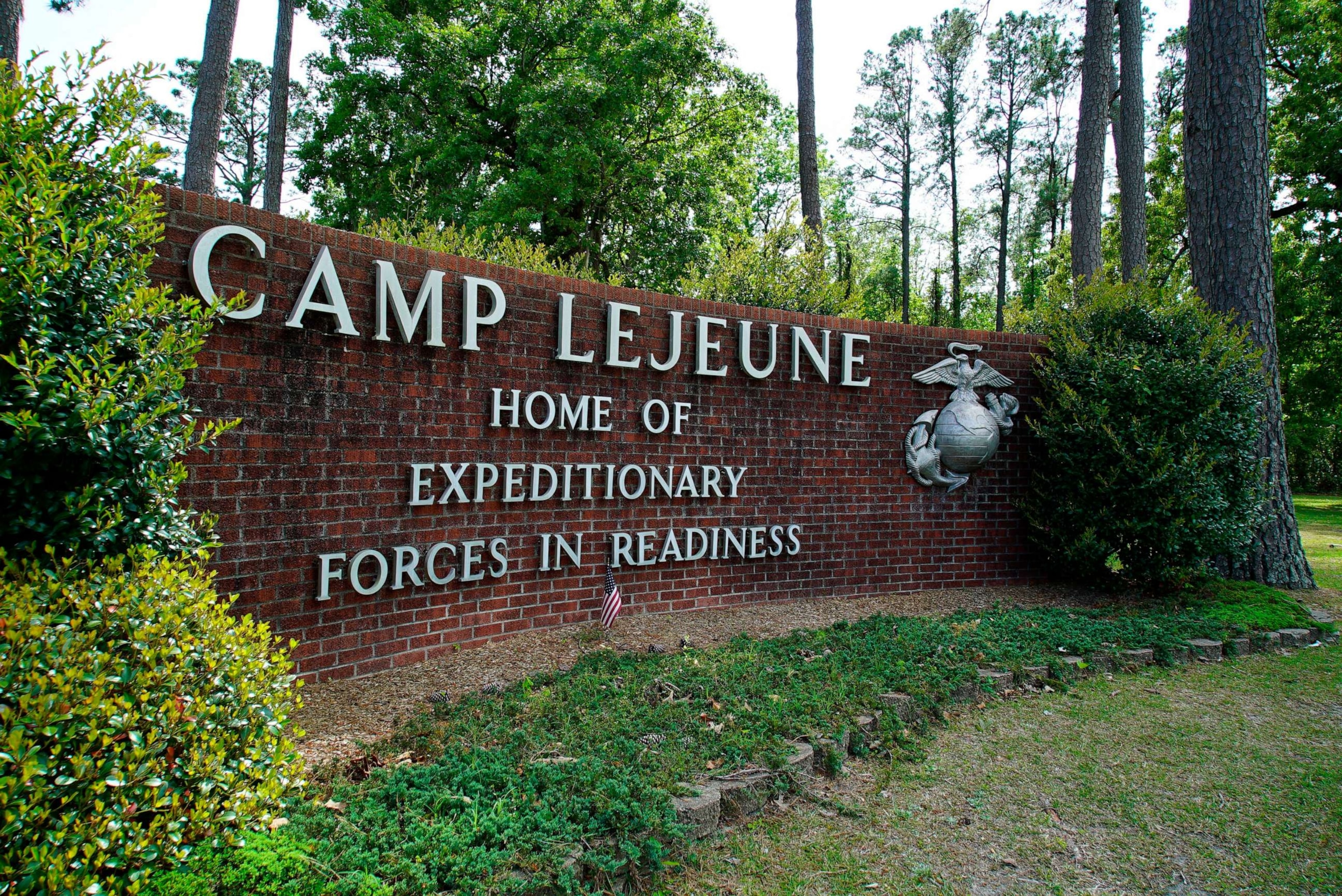 PHOTO: Signage stands on the main gate to Camp Lejeune Marine Base outside Jacksonville, N.C., April 29, 2022.