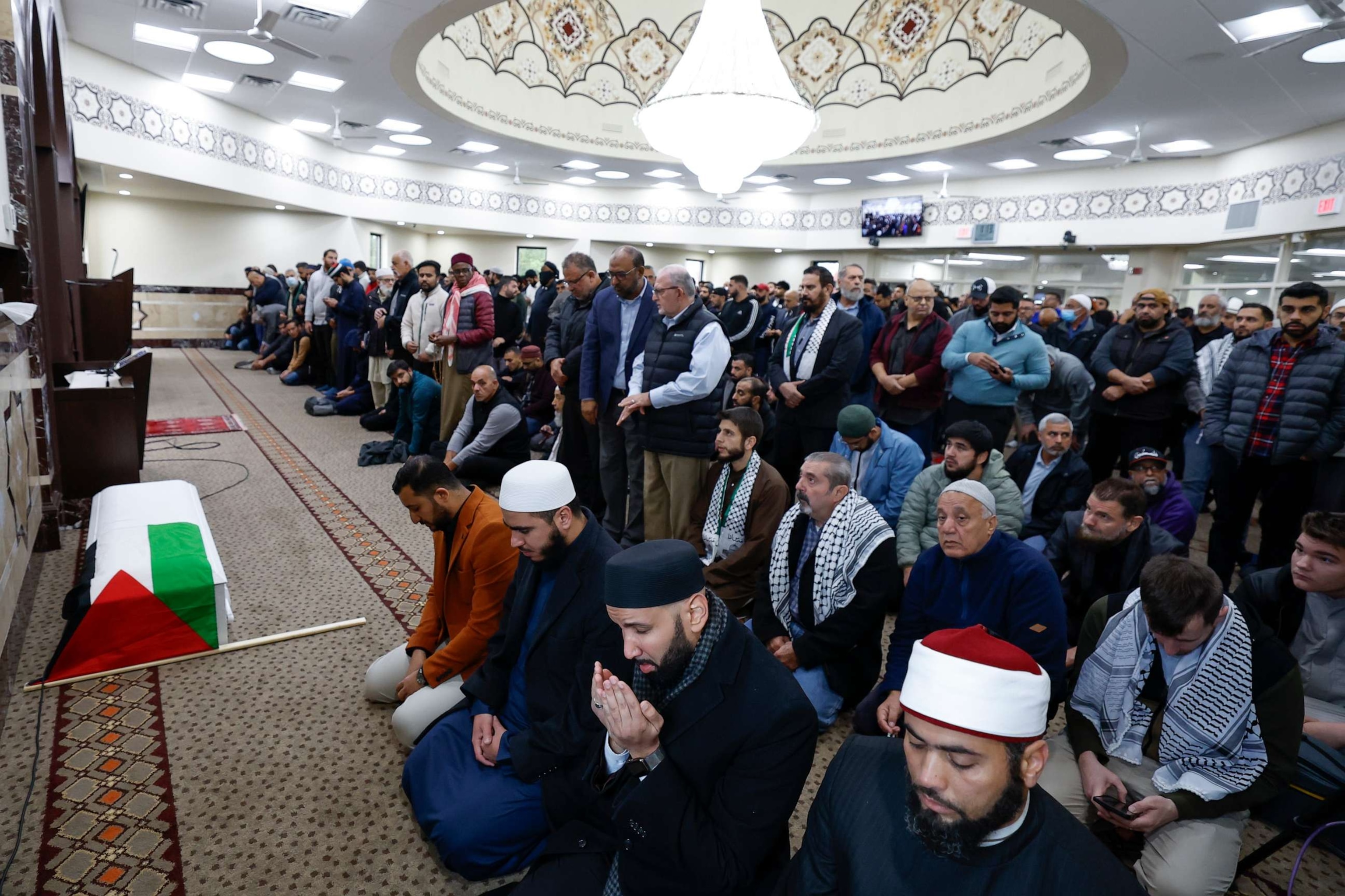 PHOTO: Community members pray during the funeral service for six-year-old Wadea Al-Fayoume at the Mosque Foundation, Oct. 16, 2023, in Bridgeview, Illinois.