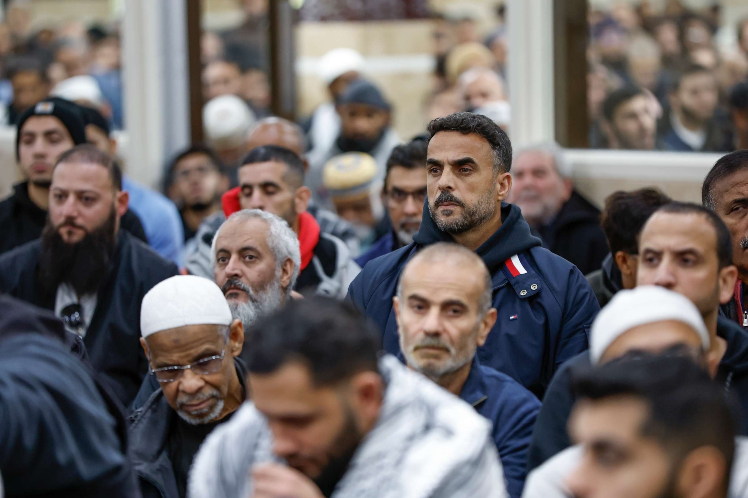 PHOTO: Community members pray during the funeral service for six-year-old Wadea Al-Fayoume at the Mosque Foundation, Oct. 16, 2023, in Bridgeview, Illinois.