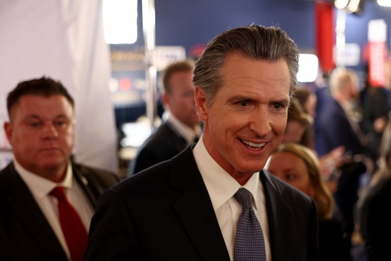 SIMI VALLEY, CALIFORNIA - SEPTEMBER 27: California Gov. Gavin Newsom talks to reporters in the spin room following the FOX Business Republican Primary Debate at the Ronald Reagan Presidential Library on September 27, 2023 in Simi Valley, California. Seven presidential hopefuls squared off in the second Republican primary debate as former U.S. President Donald Trump, currently facing indictments in four locations, declined again to participate. (Photo by Mario Tama/Getty Images)