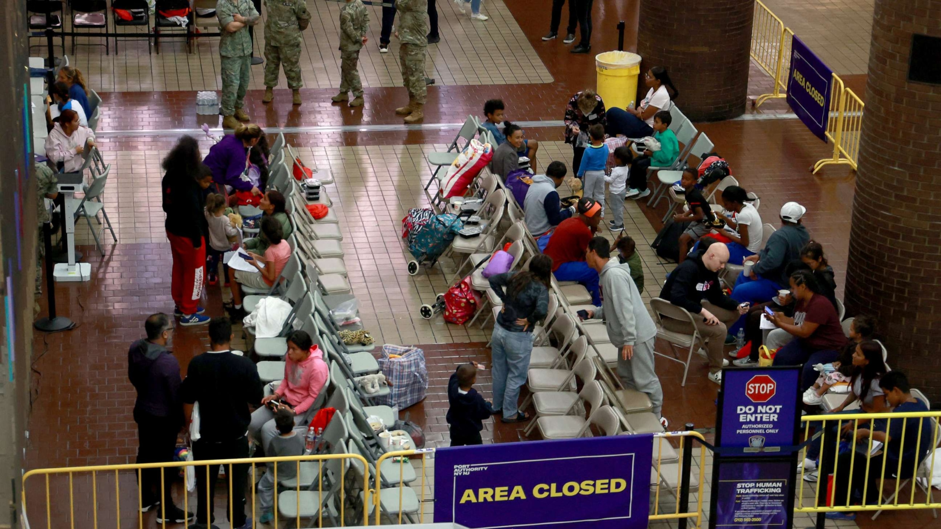 PHOTO: Recently arrived Migrants are pictured in the processing area at Port Authority Bus Terminal in New York, May 3, 2023.