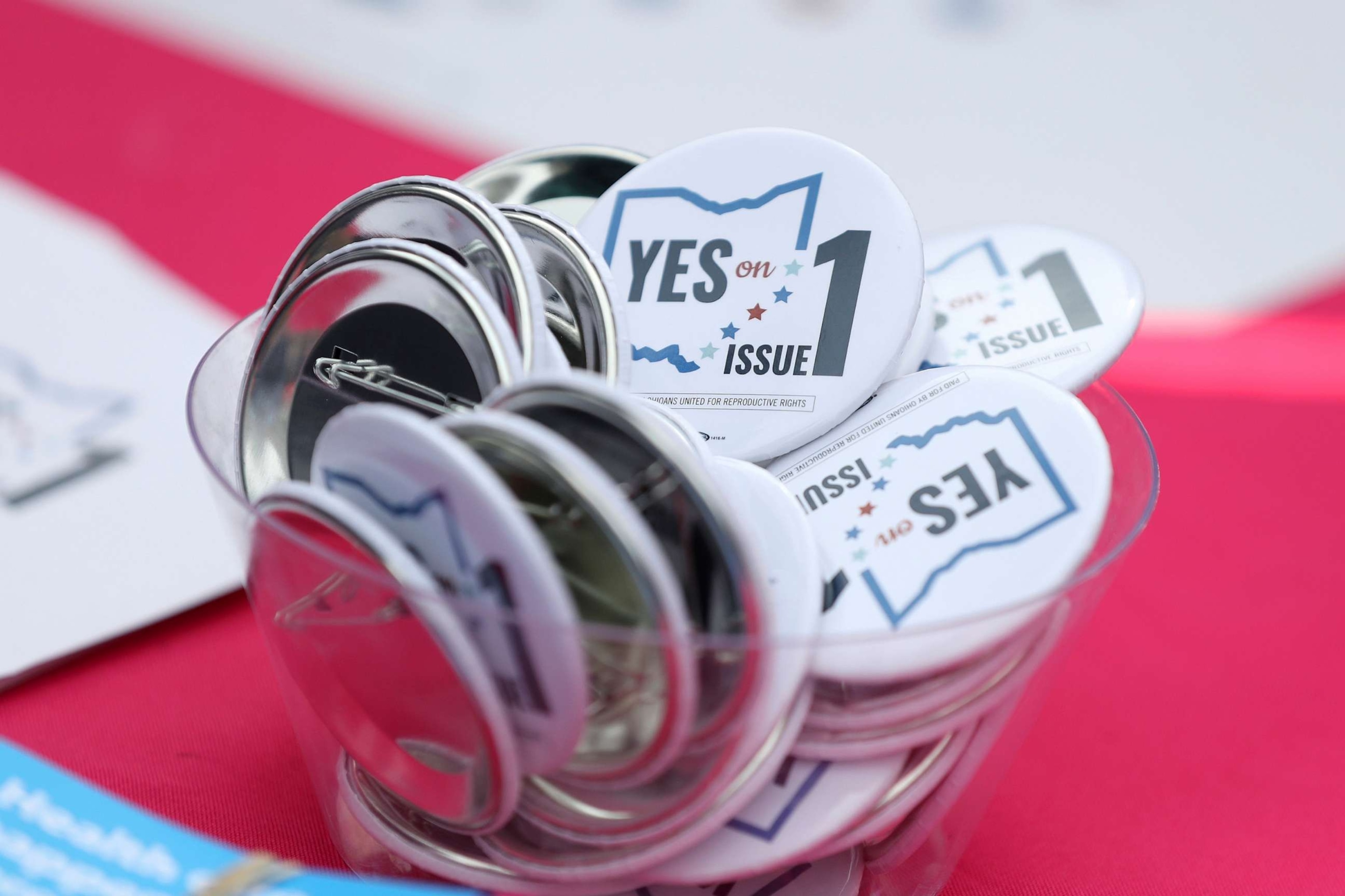 PHOTO: Buttons in support of Issue 1, the Right to Reproductive Freedom amendment, sit on display at a rally held by Ohioans United for Reproductive Rights at the Ohio Statehouse in Columbus, Ohio, Oct. 8, 2023.