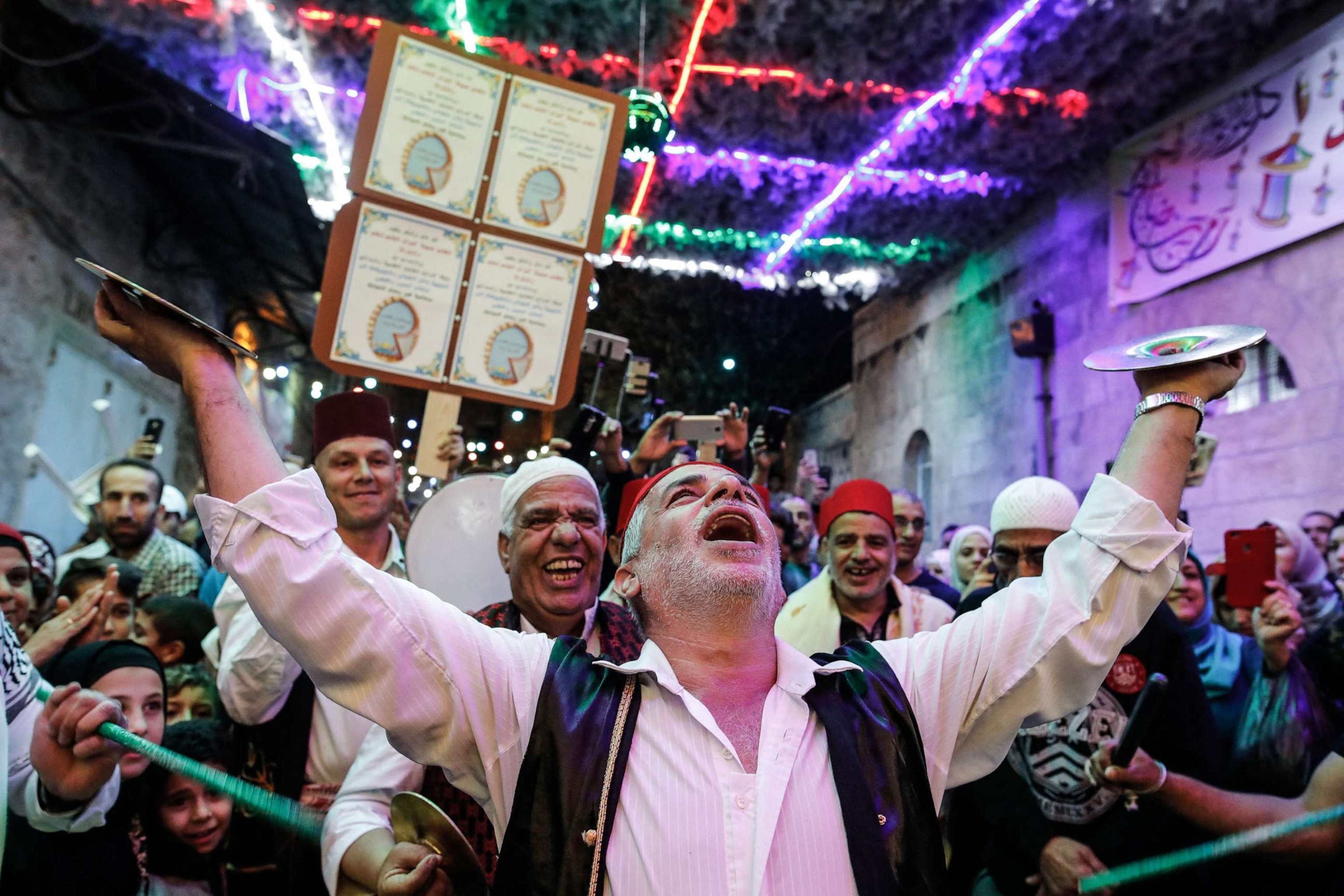 PHOTO: Palestinian musicians perform in Jerusalem's Old City to celebrate breaking the fast on the eighth day of the Islamic holy month of Ramadan on May 24, 2018.