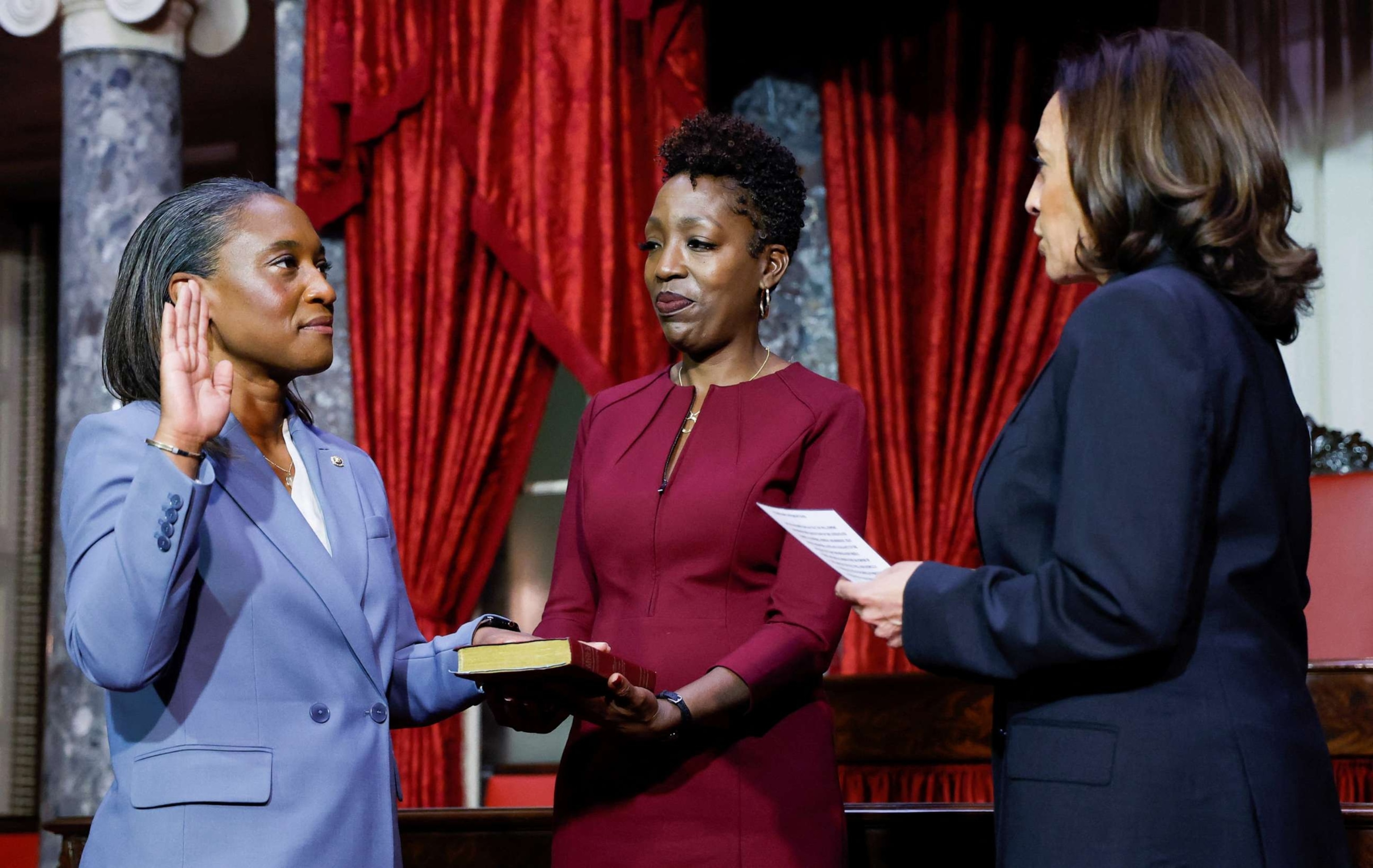PHOTO: Vice President Kamala Harris swears in Laphonza Butler to fill the U.S. Senate vacancy left by the recently deceased Senator Dianne Feinstein, as Butler's wife, Neneki Lee, holds the bible, Oct. 3, 2023, at the Capitol in Washington, D.C.