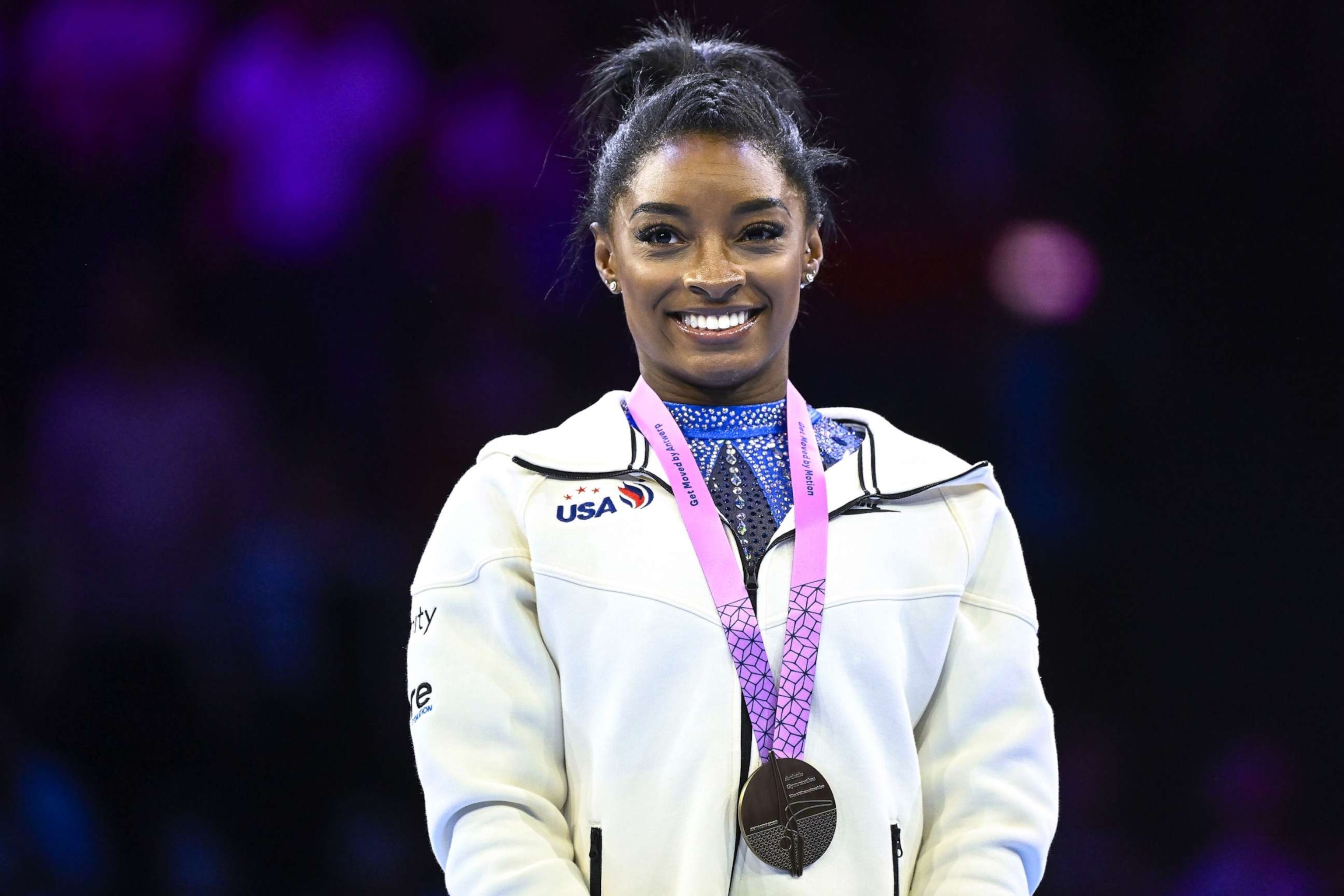 PHOTO: Simone Biles celebrates on the podium after winning the gold medal of the Women's Individual All-Around Final at the Artistic Gymnastics World Championships, in Antwerp, on Oct. 6, 2023.