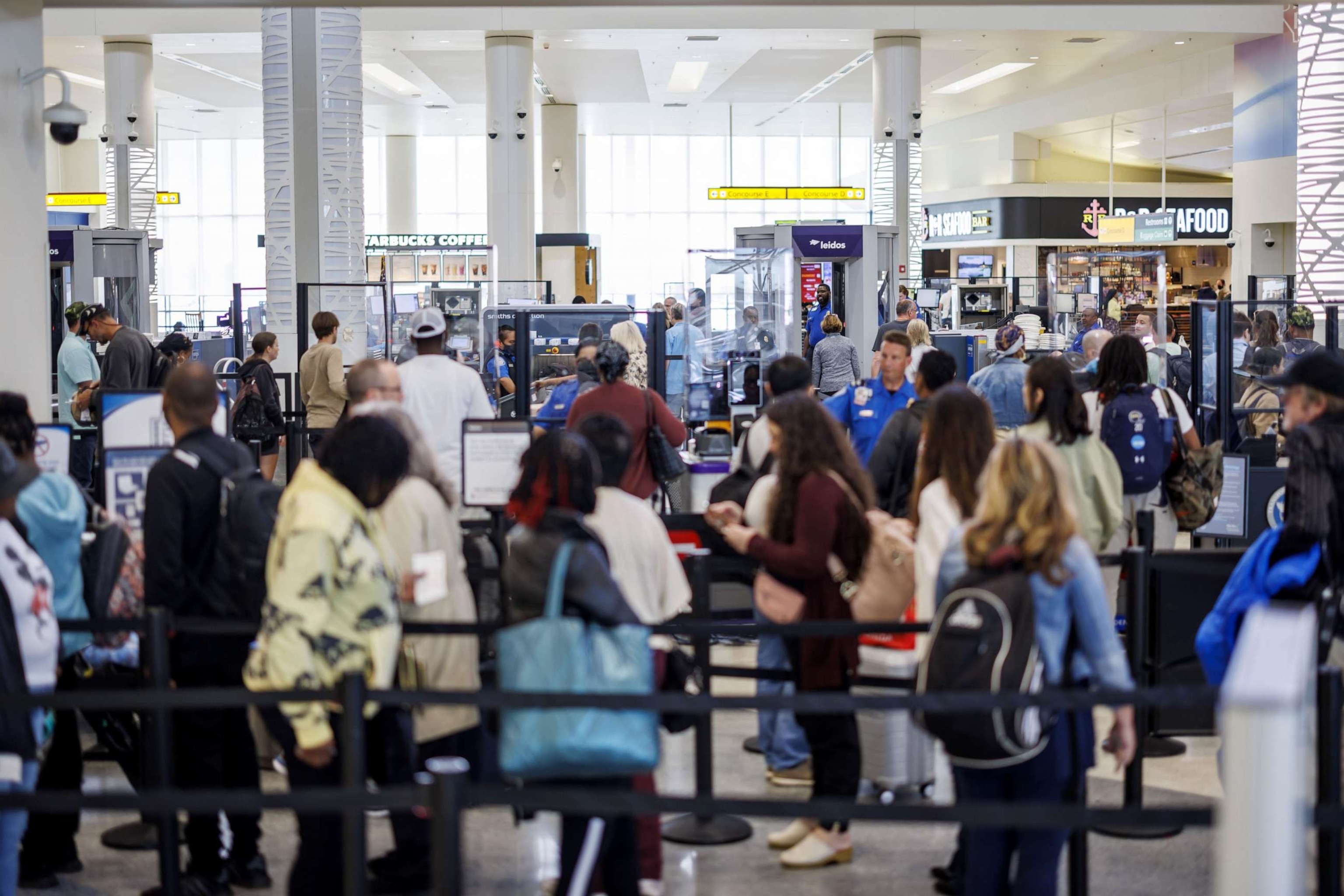 PHOTO: Departing travelers wait at a Transportation Security Administration (TSA) security checkpoint at Baltimore-Washington Airport (BWI) in Baltimore, Maryland, April 26, 2023.