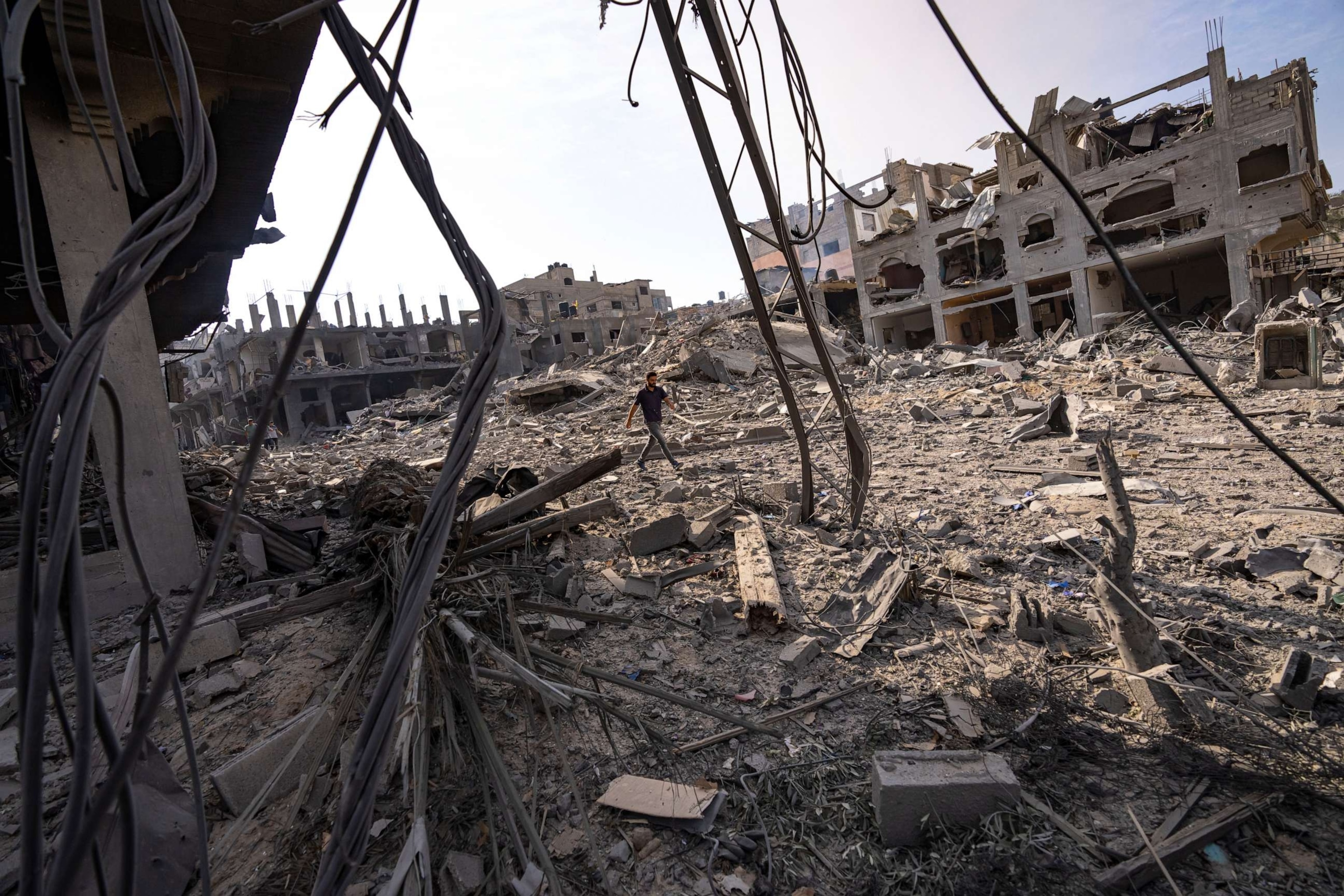 PHOTO: A person walks through the destruction by Israeli bombing in Gaza City, Oct. 11, 2023.
