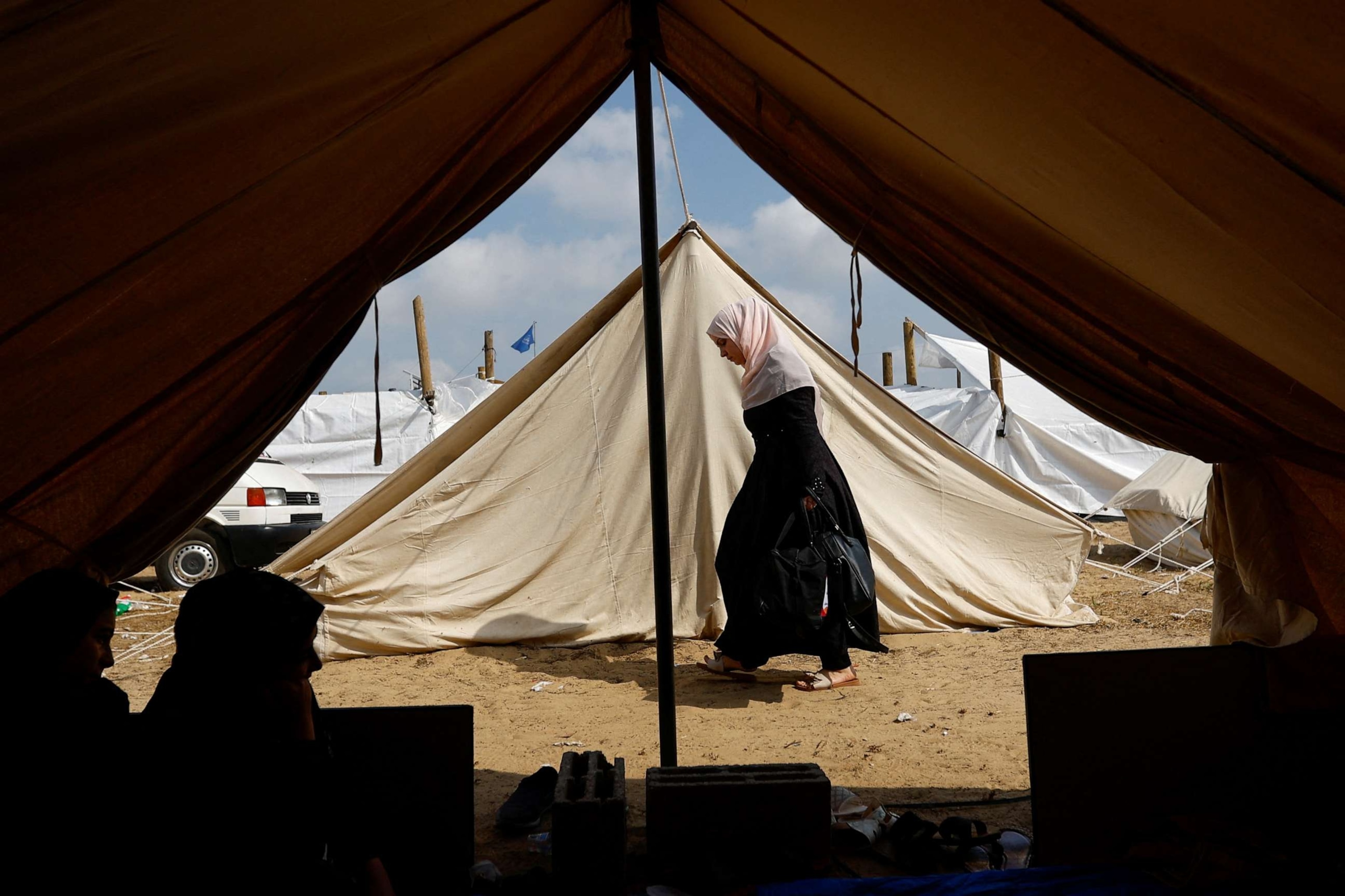 PHOTO: A woman walks through a tent camp at a United Nations-run center in Khan Younis in the southern Gaza Strip, Oct. 23, 2023.