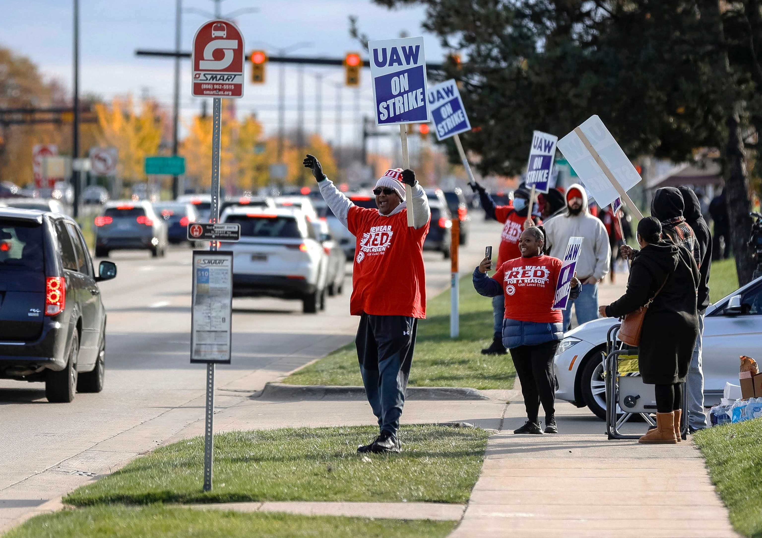 PHOTO: UAW Local 1700 members walk the picket line outside of Stellantis Sterling Heights Assembly in Sterling Heights on Oct. 28, 2023.