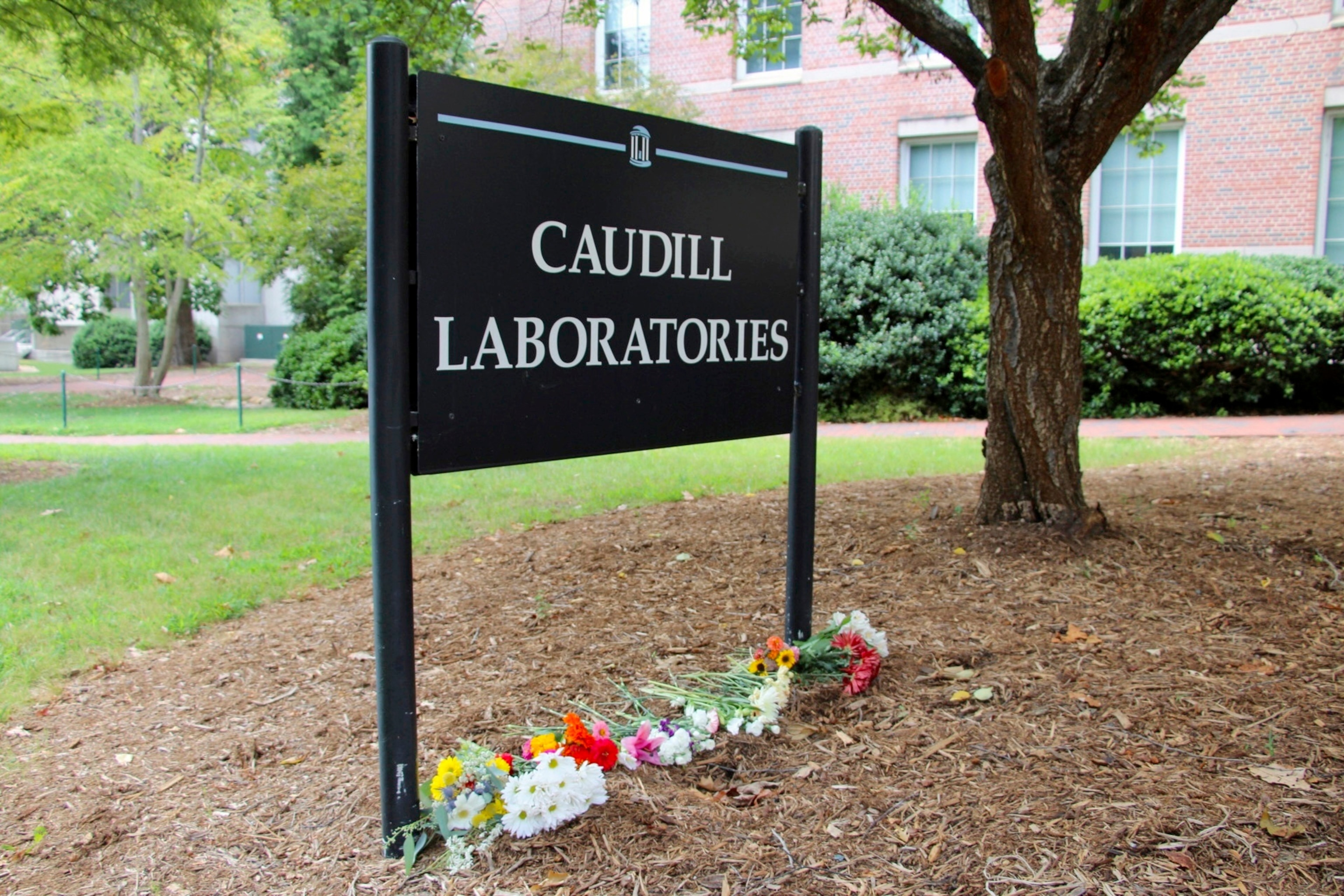 PHOTO: Flowers are seen piled up in front of Caudill Laboratories, Aug. 29, 2023, on the UNC-Chapel Hill campus, where a graduate student fatally shot his faculty advisor this week in Chapel Hill, N.C.