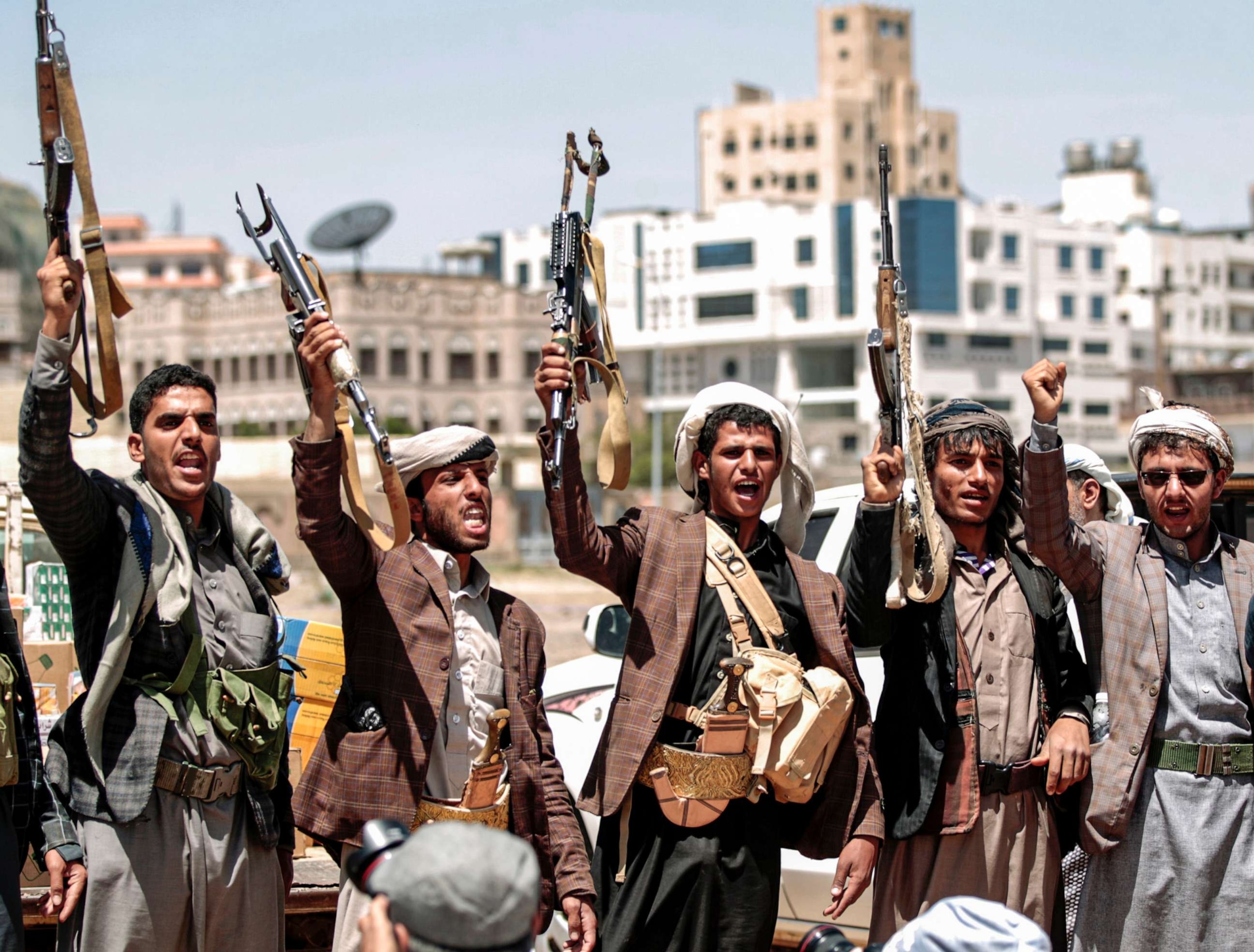 PHOTO: Men chant slogans as they hold up Kalashikov assault rifles during a tribal meeting in the Houthi rebel-held capital Sanaa, Yemen, Sept. 21, 2019.