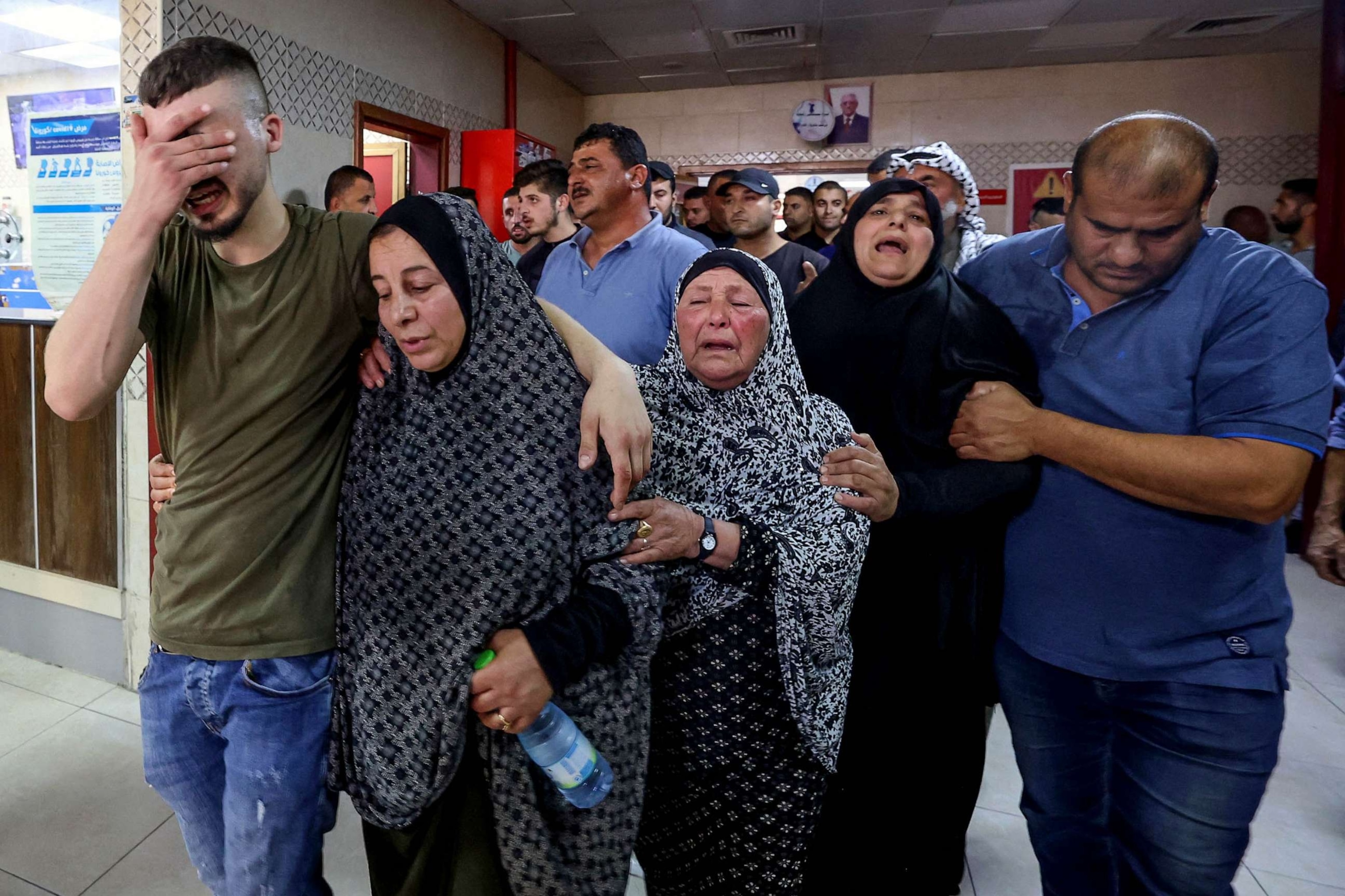 PHOTO: Palestinians mourn a relative who reportedly died following his injury in clashes with Israeli settlers in Qusra village, into Rafidia hospital in Nablus city in the occupied West Bank, Oct. 11, 2023.