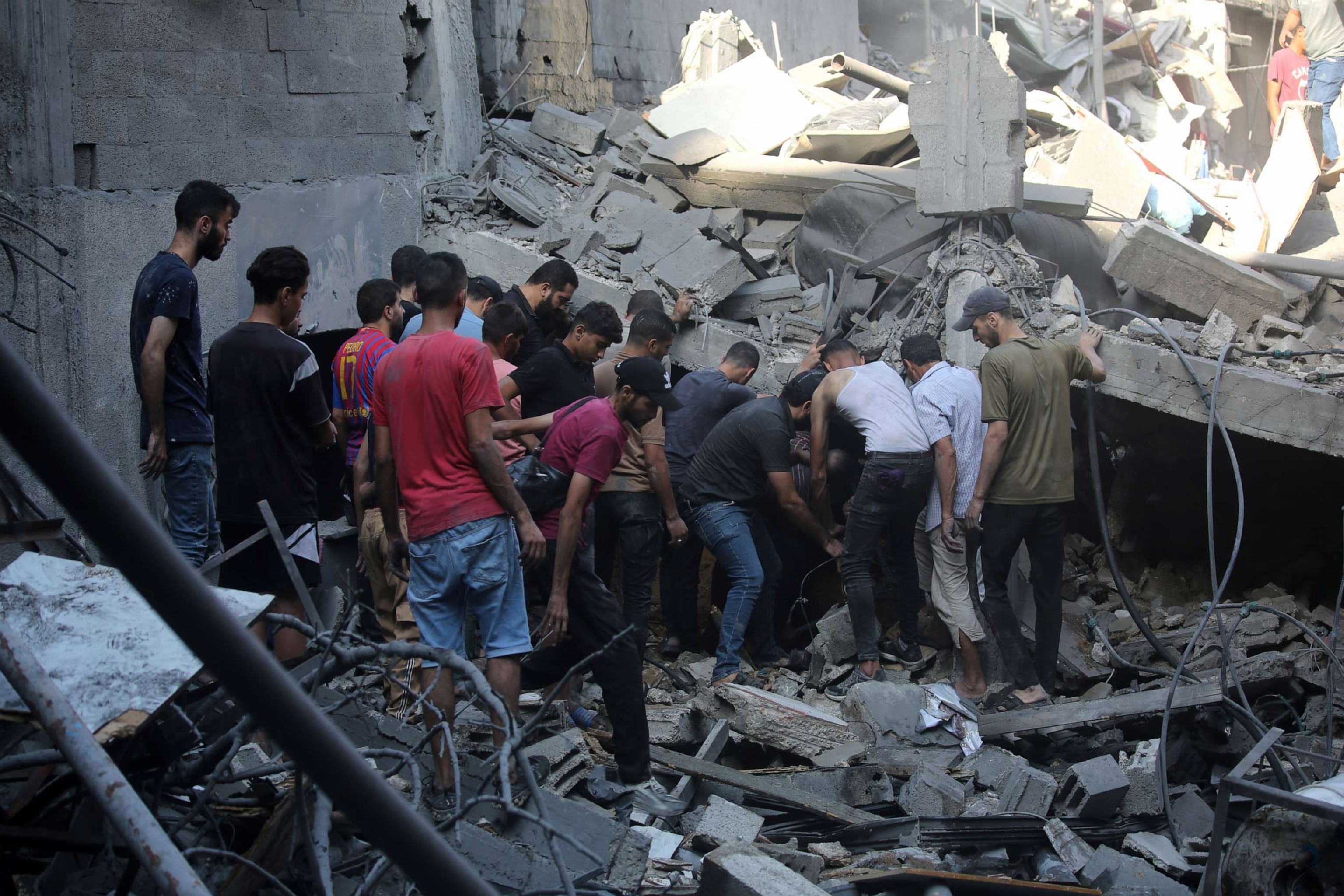 PHOTO: Palestinian citizens inspect damage to their homes caused by Israeli airstrikes on October 12, 2023 in Gaza City, Gaza.