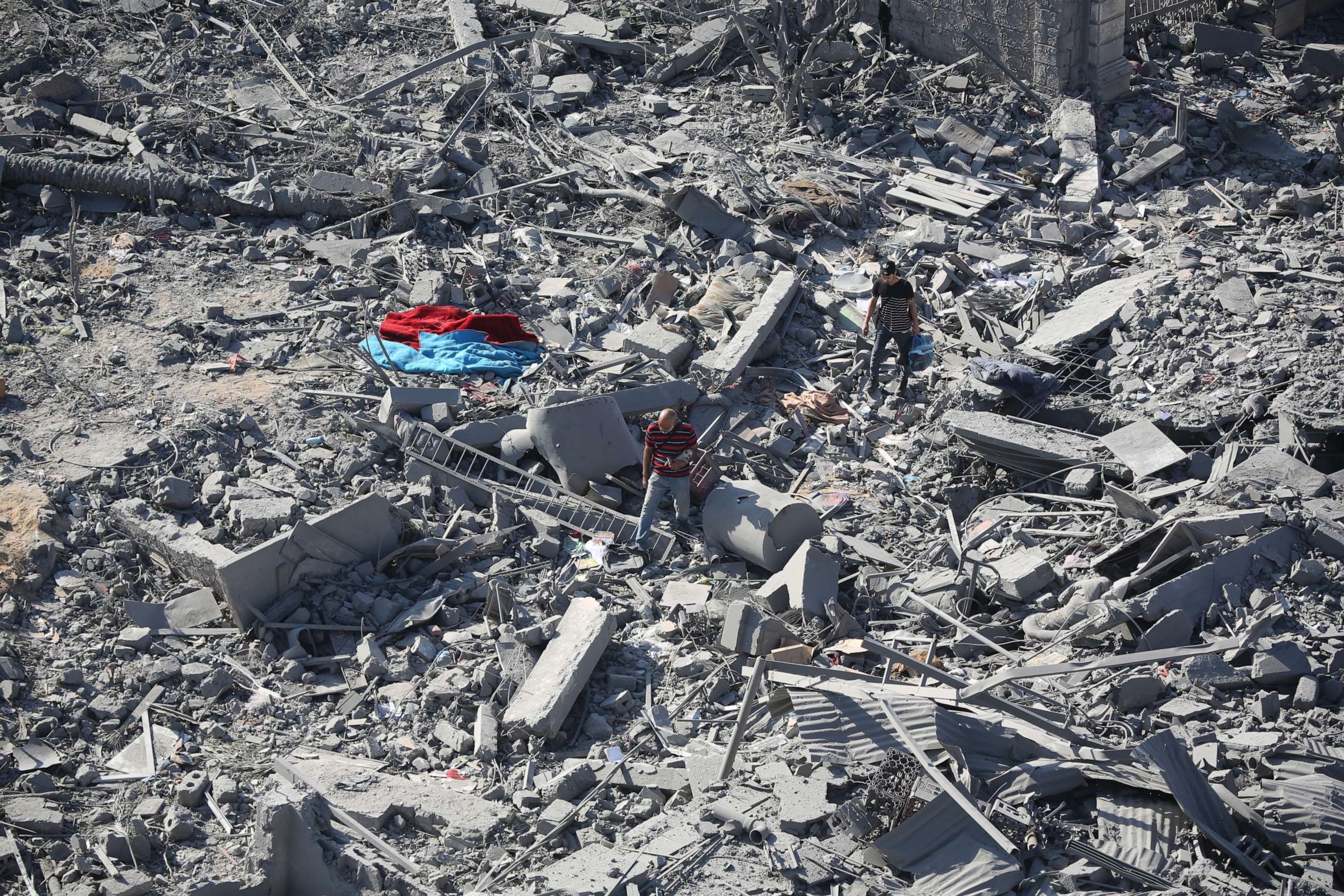 PHOTO: Citizens inspect damage to their homes caused by Israeli airstrikes, Oct. 13, 2023 in Gaza City, Gaza.
