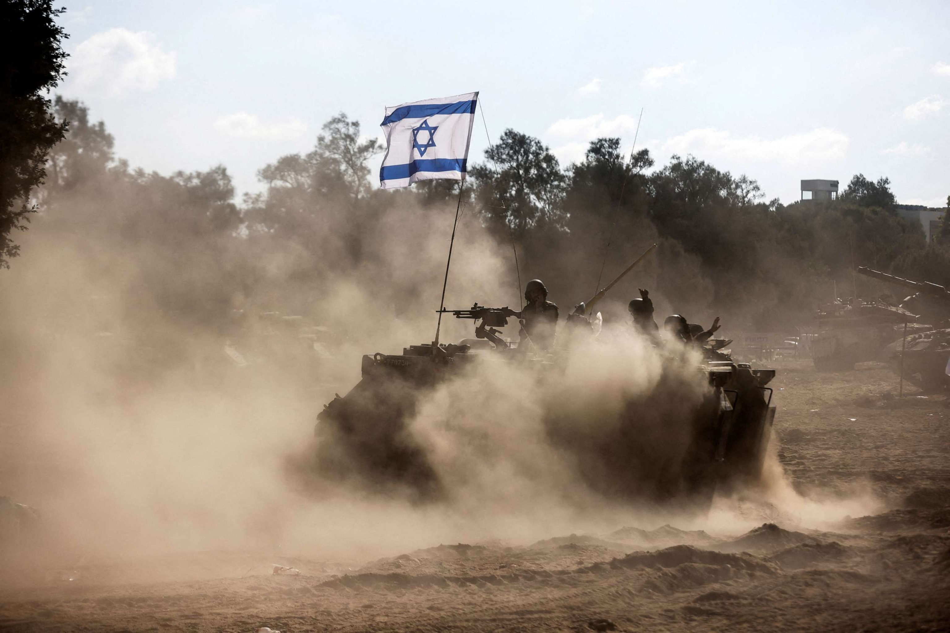 PHOTO: An Israeli Armored Personnel Carrier (APC) takes position near Israel's border with the Gaza Strip, in southern Israel, Oct. 13, 2023.