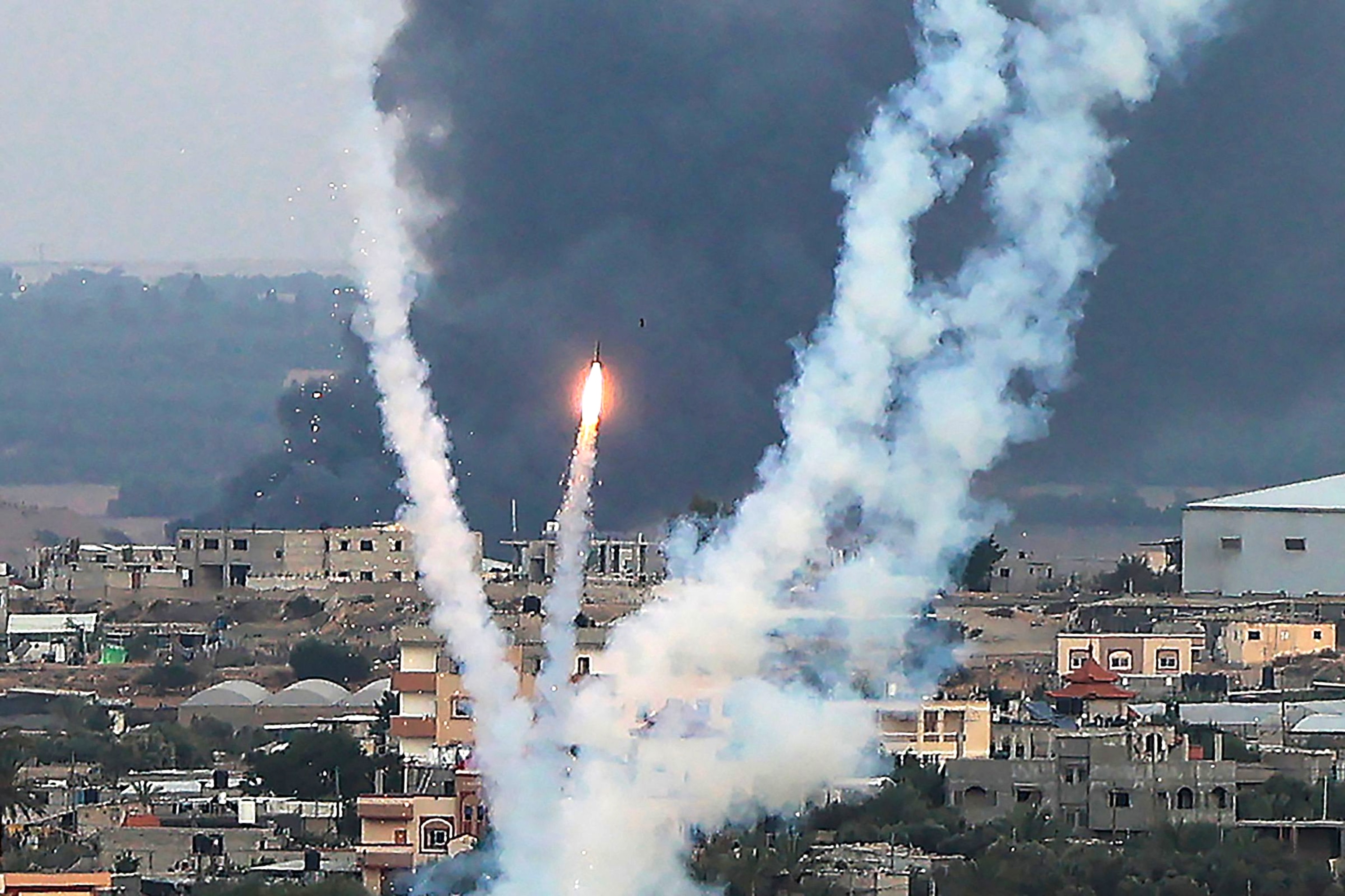 PHOTO: Palestinian militants fire rockets towards Israel from Rafah, southern Gaza Strip, on October 11, 2023.