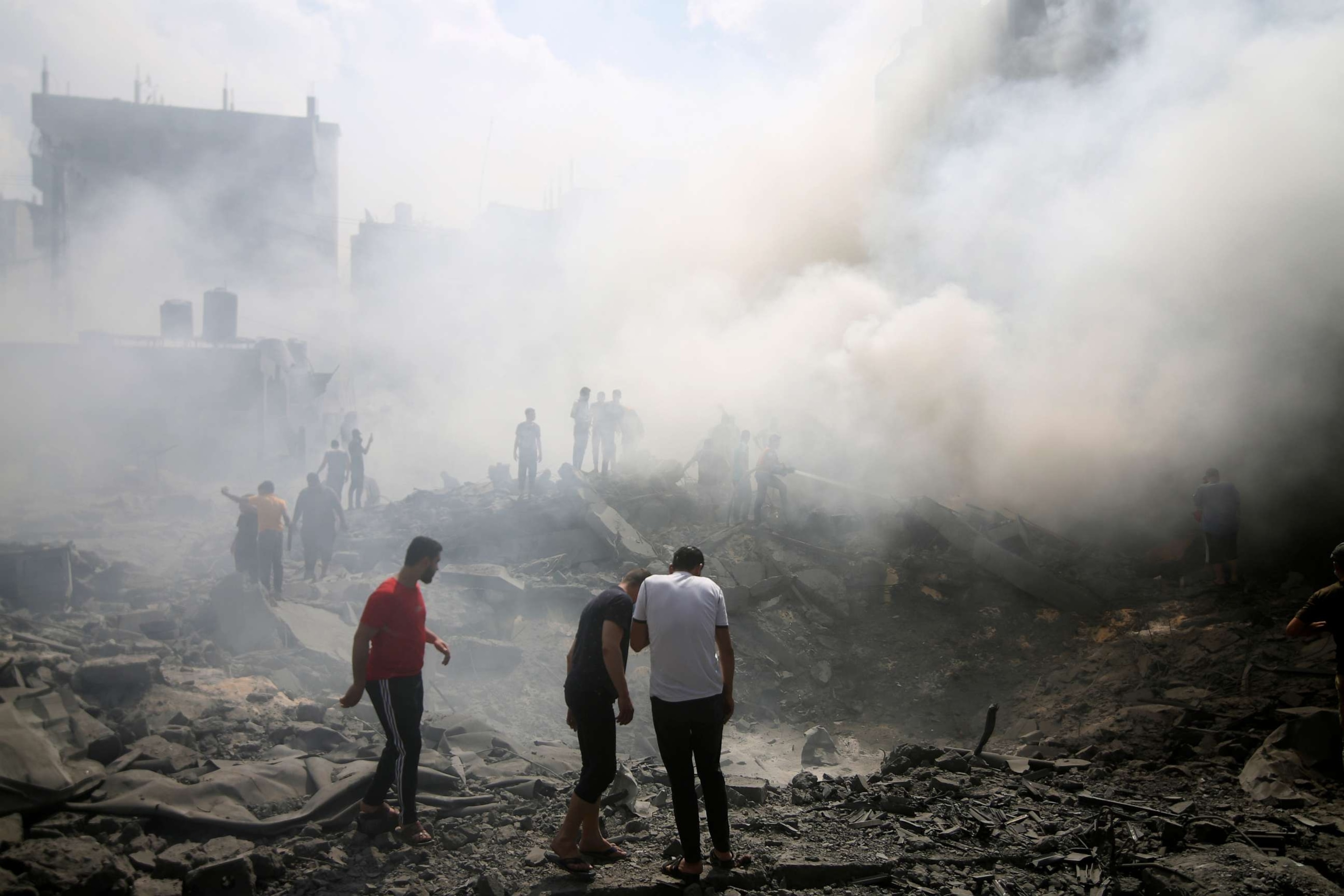 PHOTO: Palestinians look for survivors after an Israeli airstrike in Rafah refugee camp, southern Gaza Strip, Oct. 12, 2023.