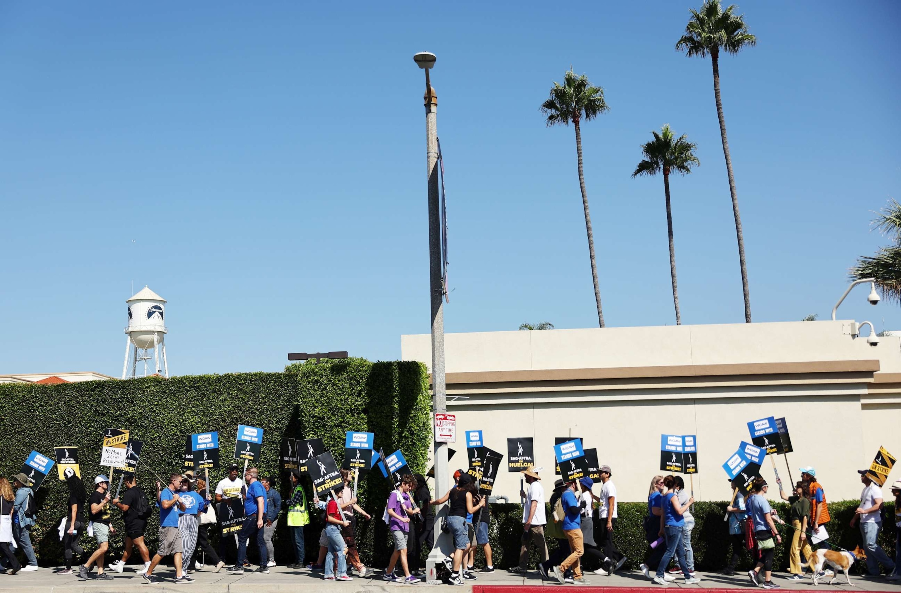 PHOTO: Striking SAG-AFTRA members picket as WGA (Writers Guild of America) members march in solidarity outside Paramount Studios on October 02, 2023 in Los Angeles, California.