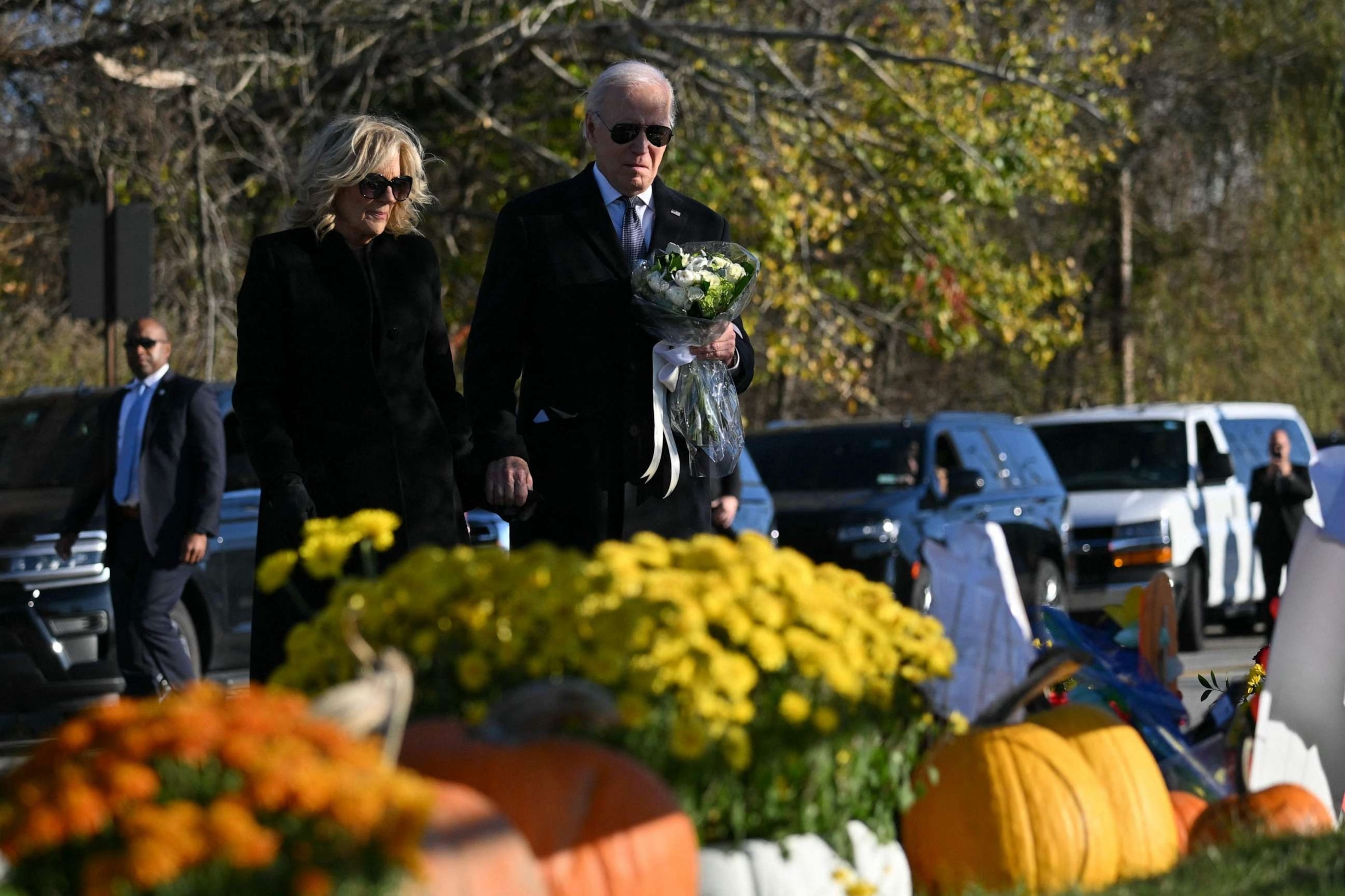 PHOTO:US President Joe Biden and First Lady Jill Biden pay their respects outside Schemengees Bar and Grille in Lewiston, Maine, on Nov. 3, 2023.