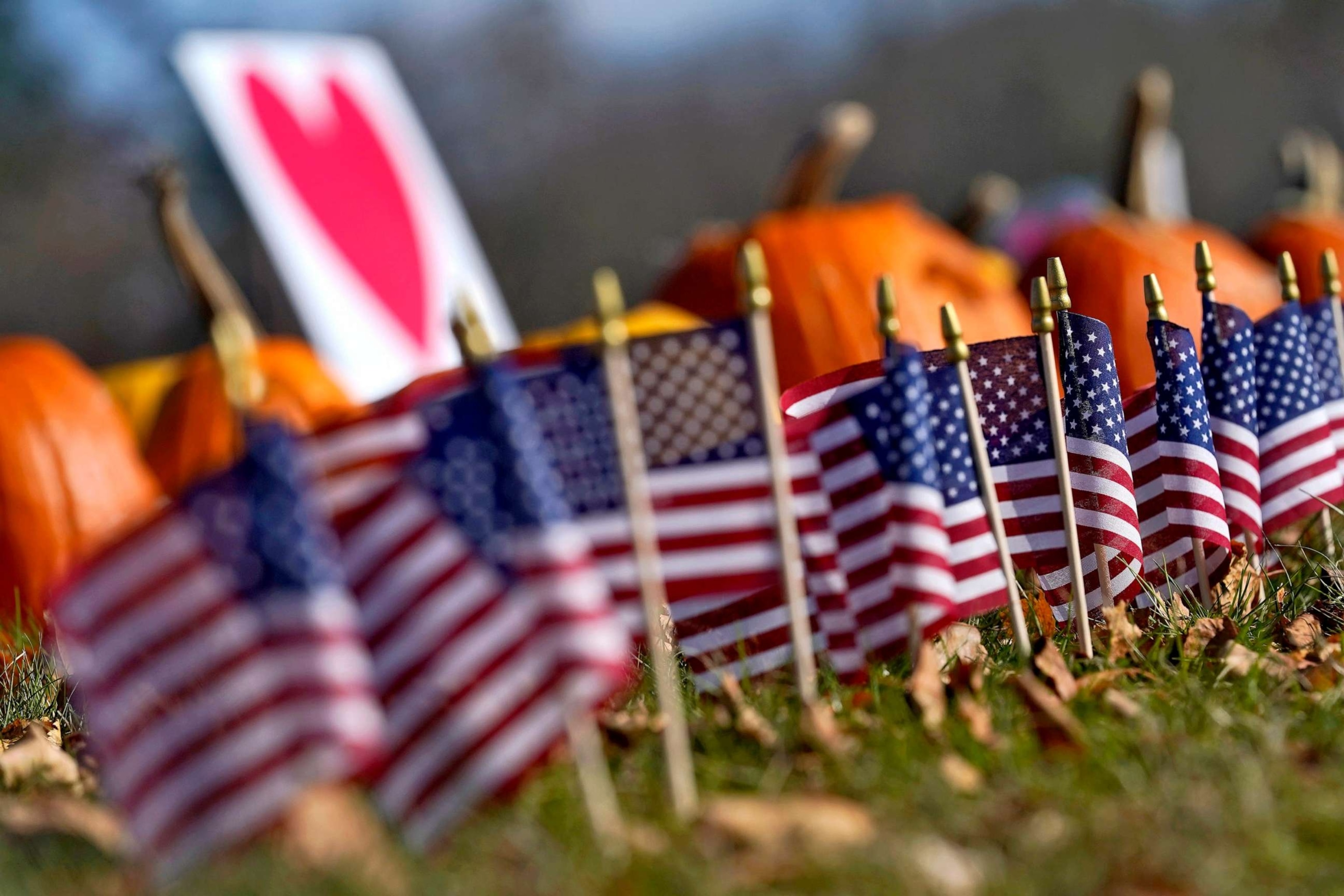 PHOTO: Pumpkins and flags line the curbside outside Sparetime Bowling, Nov. 3, 2023, Lewiston, Maine, prior to the arrival of President Joe Biden.