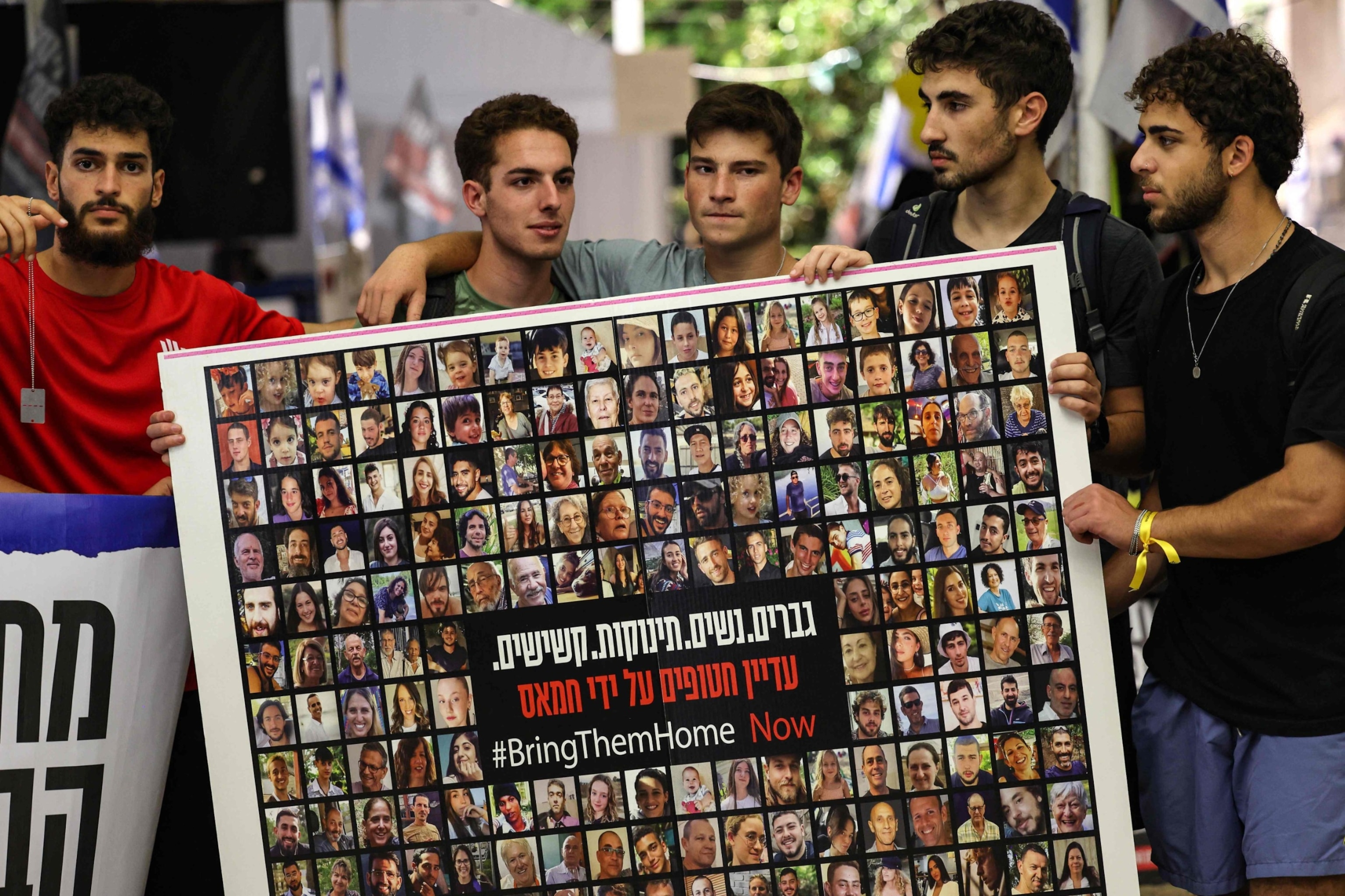 PHOTO: Relatives, friends and supporters of Israeli hostages held in Gaza since the October 7 attack by Hamas militants in southern Israel, hold placards and images of those taken during a protest for their release in Tel Aviv, Nov. 22, 2023.