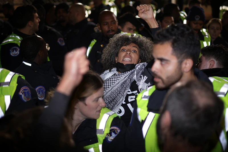 Jewish Peace Activists Rally Near Capitol Hill
WASHINGTON, DC - NOVEMBER 15: Members of U.S. Capitol Police take a protester away from the headquarters of the Democratic National Committee during a demonstration against the war between Israel and Hamas on November 15, 2023 on Capitol Hill in Washington, DC. Jewish Voice for Peace and If Not Now held a candlelight vigil to call for a ceasefire in the Israel-Hamas war. (Photo by Alex Wong/Getty Images)