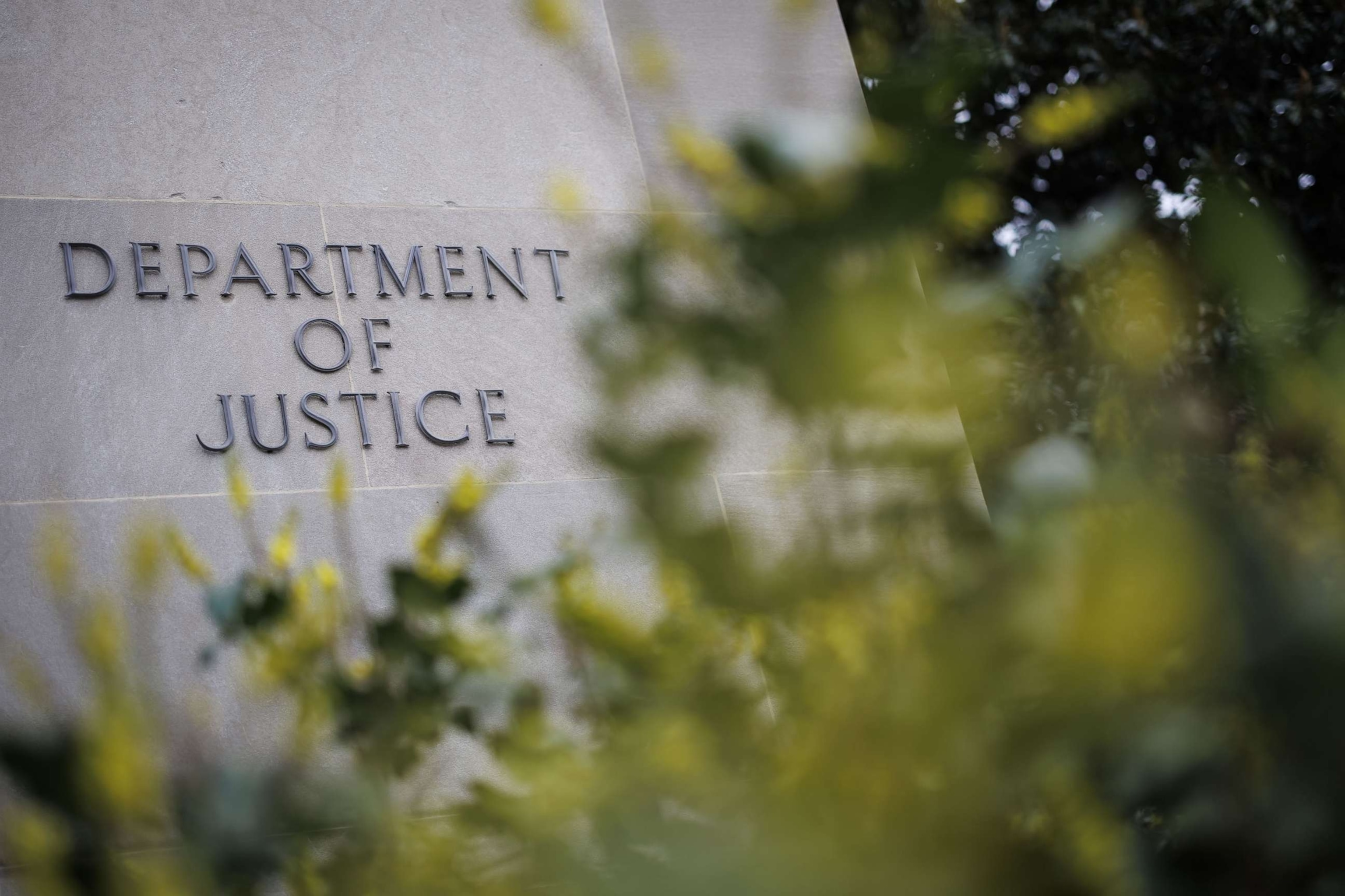 Signage outside the US Department of Justice (DOJ) headquarters in Washington, DC, US, on Friday, Feb. 17, 2023