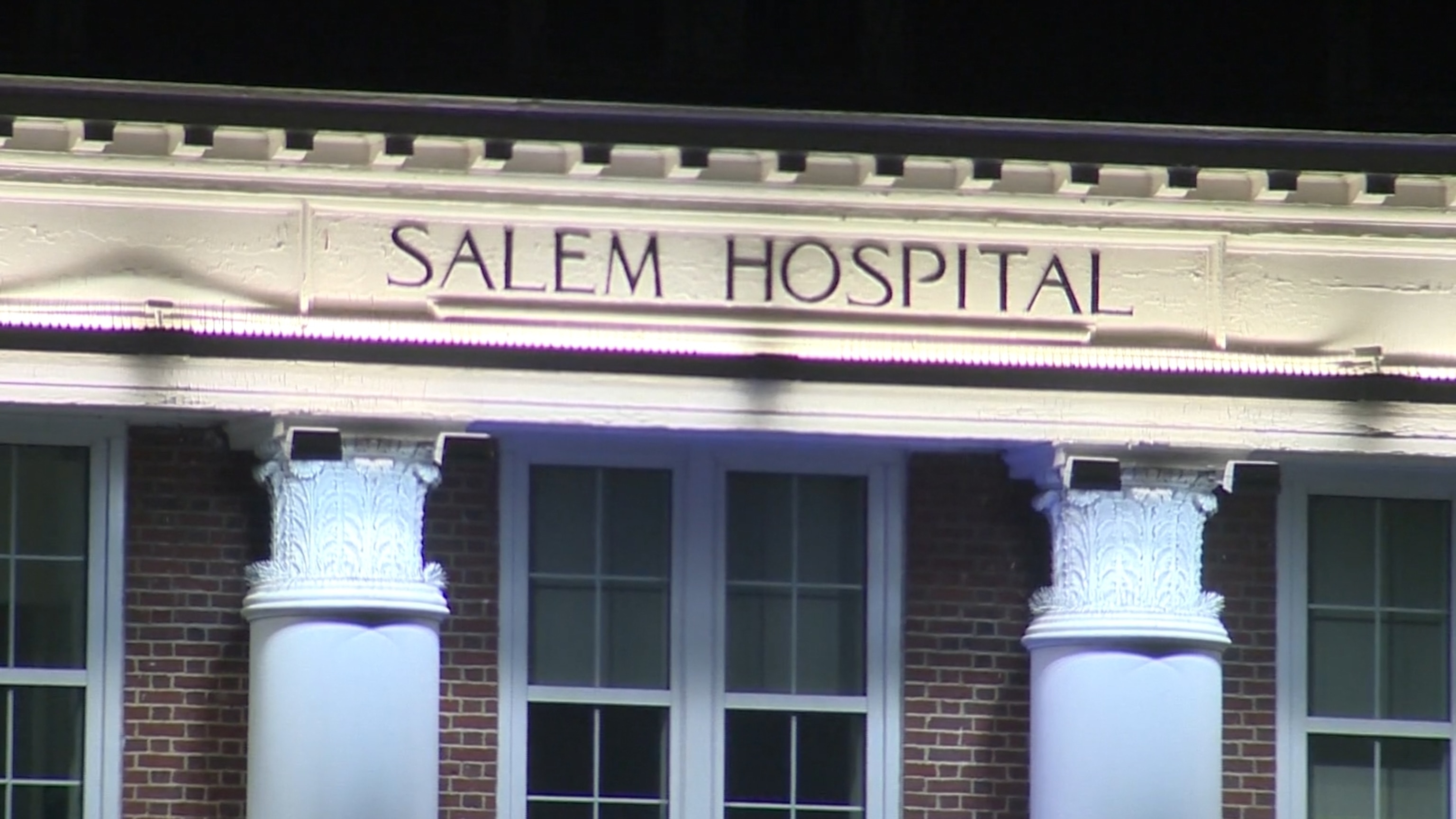 PHOTO: A Salem Hospital sign is seen on the front of a building in Salem, Mass.