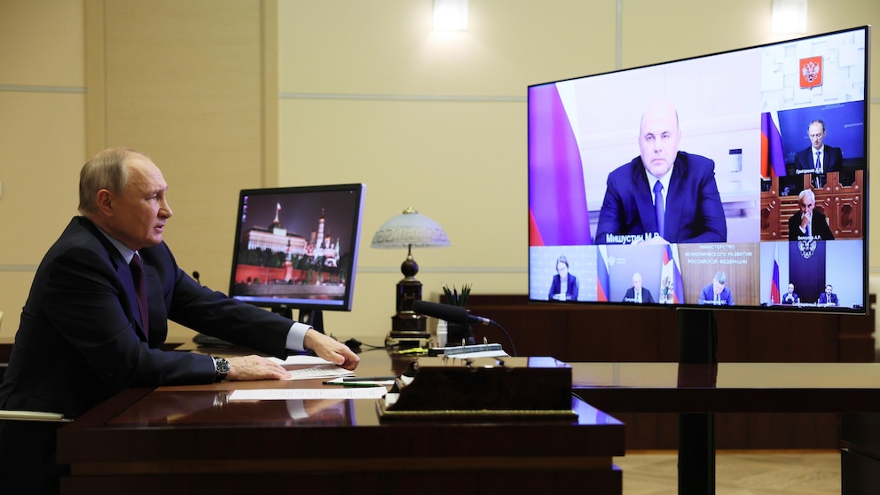 Russian President Vladimir Putin chairs a meeting on economic issues via videoconference at the Novo-Ogaryovo state residence outside Moscow, Russia, Wednesday, Nov. 1, 2023. Russian Prime Minister Mikhail Mishustin is seen on the screen. (Gavriil Grigorov, Sputnik, Kremlin Pool Photo via AP)