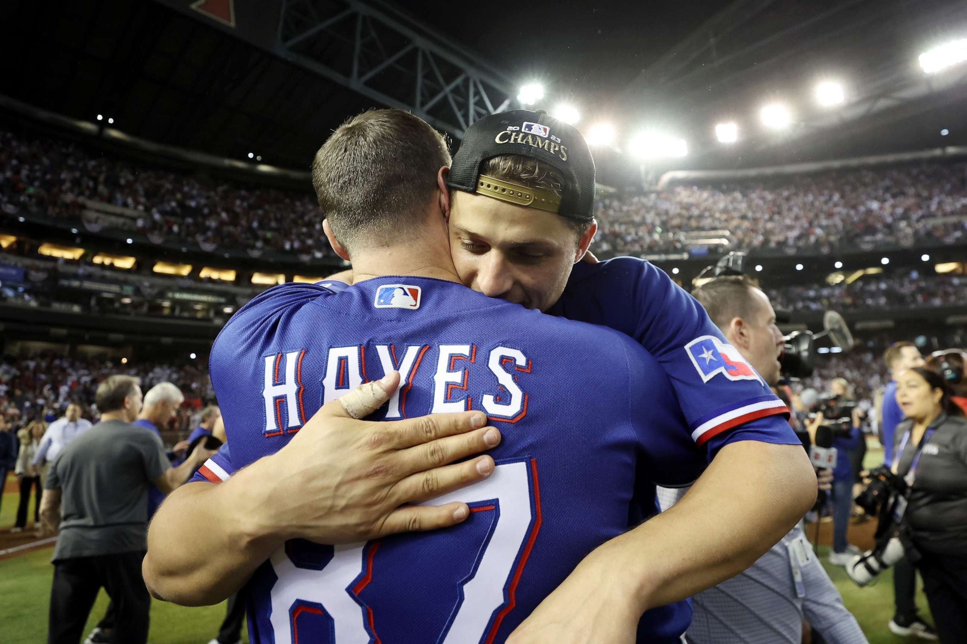 Coach Brett Hayes and Corey Seager #5 of the Texas Rangers celebrate after the Texas Rangers beat the Arizona Diamondbacks 5-0 in Game Five to win the World Series at Chase Field on November 01, 2023 in Phoenix, Arizona