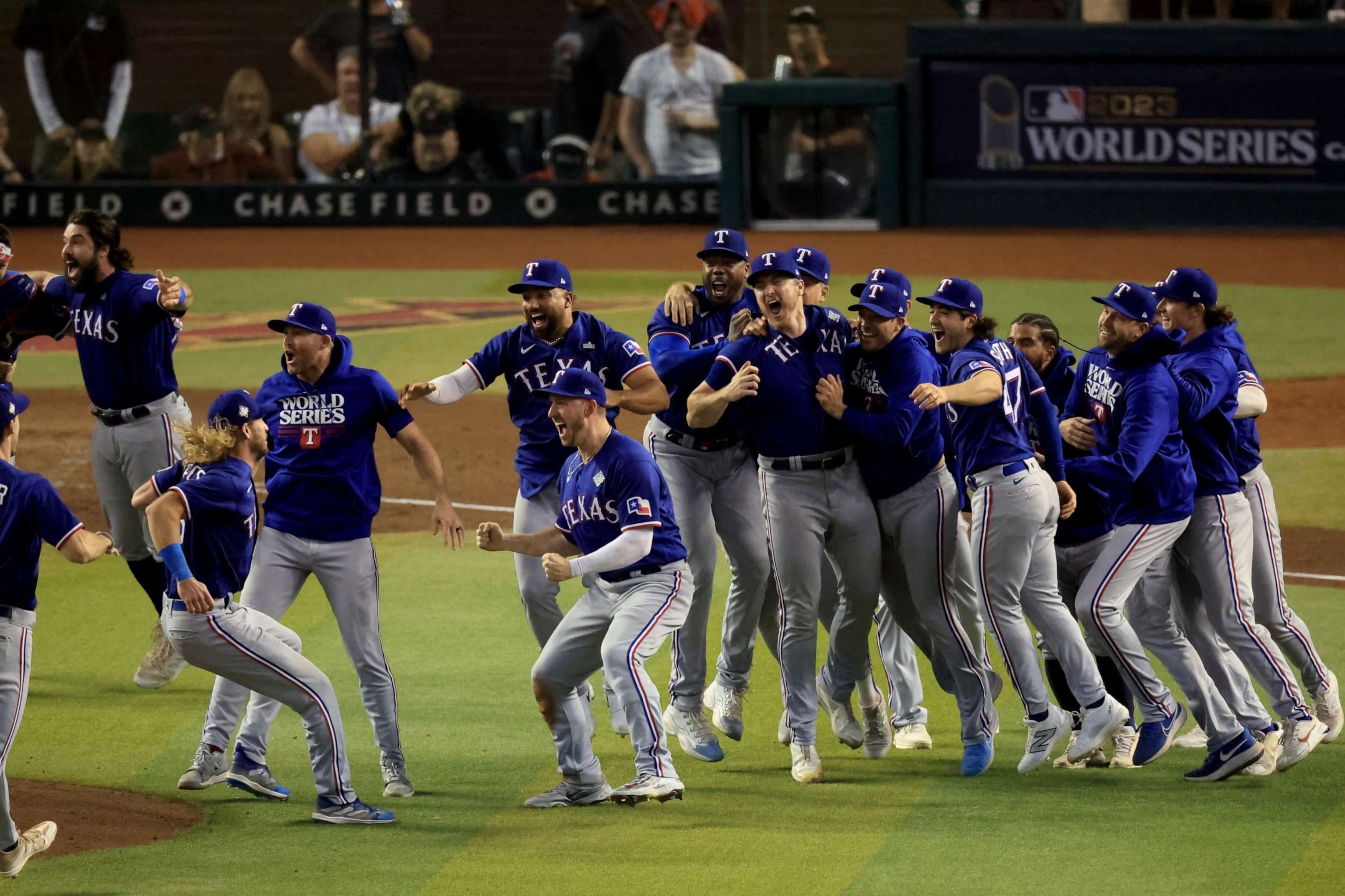 The Texas Rangers celebrate after beating the Arizona Diamondbacks 5-0 in Game Five to win the World Series at Chase Field on November 01, 2023 in Phoenix, Arizona. (Photo by Sean M. Haffey/Getty Images)